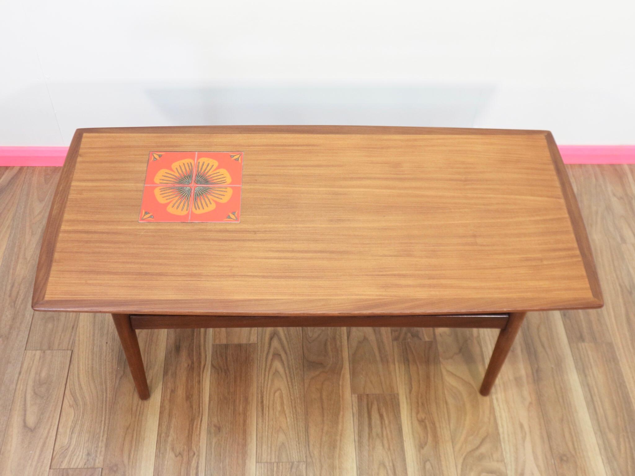 This absolutely stunning coffee table is the perfect item to inject some Mid-Century sophistication into your home. With some beutiful inlaid tiles it does have all the design features you could ever want. Produced by G paln this is a quality piece