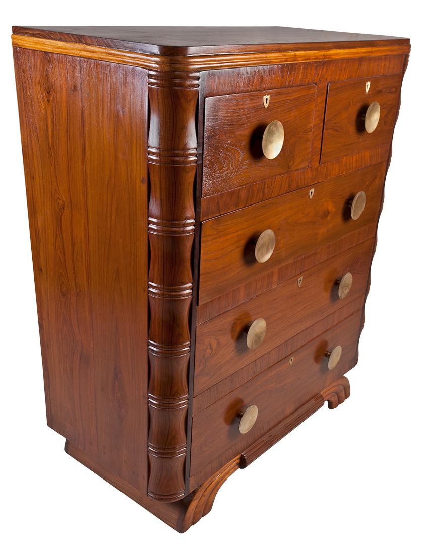 A Mid-Century Modern teak chest of drawers with faux bamboo sides and fabulous round brass drawers pulls. Two over three drawers and interesting details.