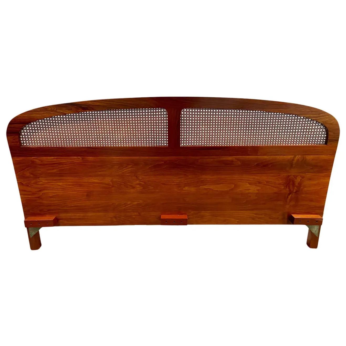 A Mid-Century Modern Queen Size headboard made of quality teak. The headboard feature two caned panels and stylish curvy shape adding charm to its design. Sturdy and finely made, the headboard simplicity and elegance will elevate the design of any