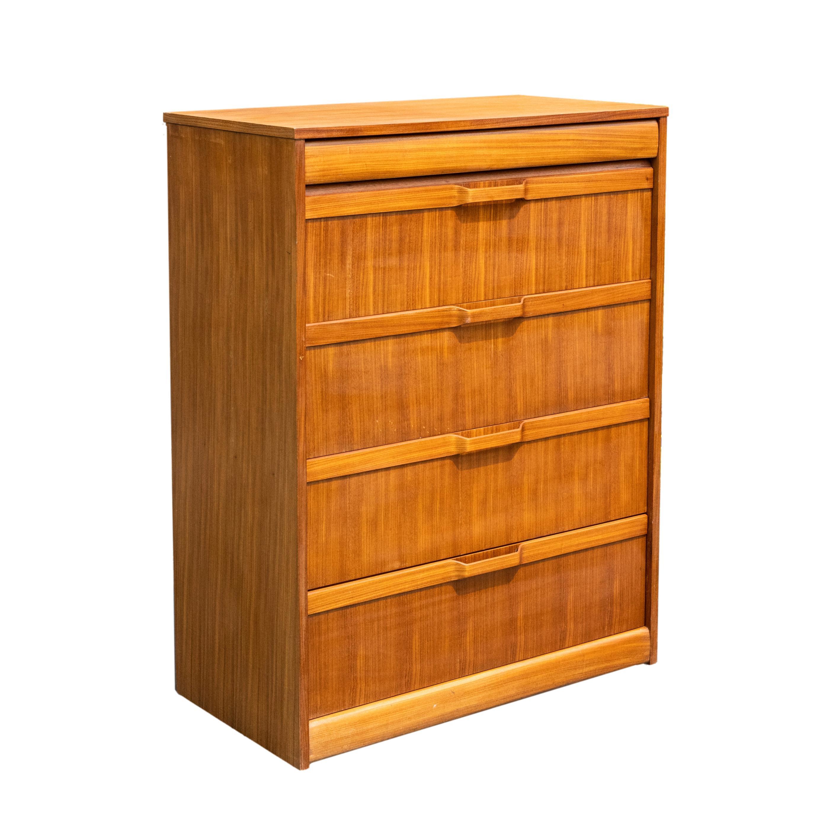 Mid-Century Modern teak and elm chest-of-drawers, the top with a 'hidden' frieze drawer in elm, above four large drawers, each with applied laminate bands with molded, open pulls in elm, on a conforming base, with illegible maker's stamp on the back