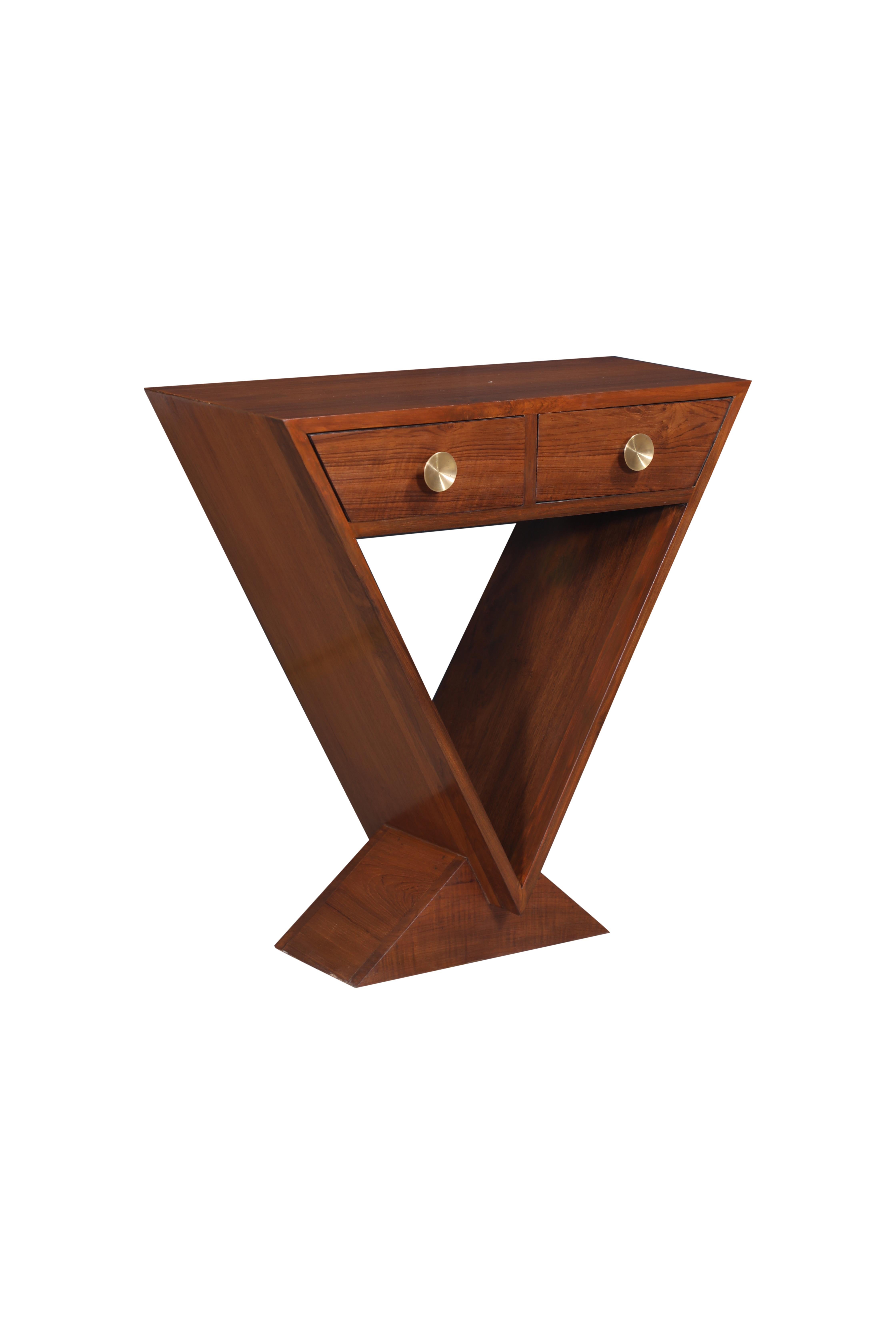 A Mid-Century Modern teak angled triangular side table with two front drawers.  Brass drawer pulls.  Great style and design.  Circa 1970's.

The Lockhart Collection is a personally curated gallery of antiques and fine jewelry, owned and operated by