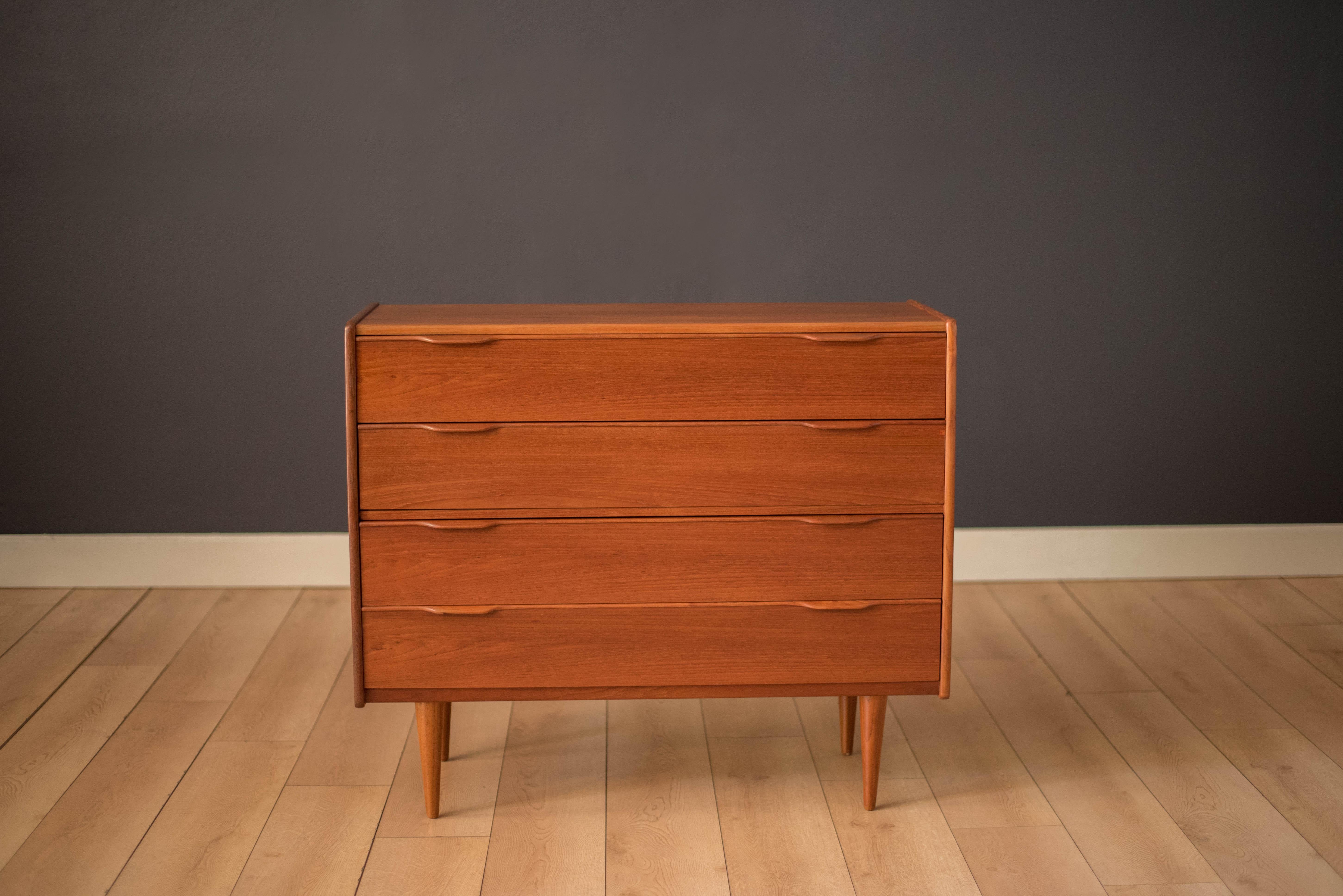 Vintage Danish chest of drawers in teak designed by Henning Jørgensen for Fredericia Møbelfabrik, Denmark circa 1960s. This unique low profile chest of drawers is perfect to use as an entryway piece or bedroom dresser. Includes four dovetail storage
