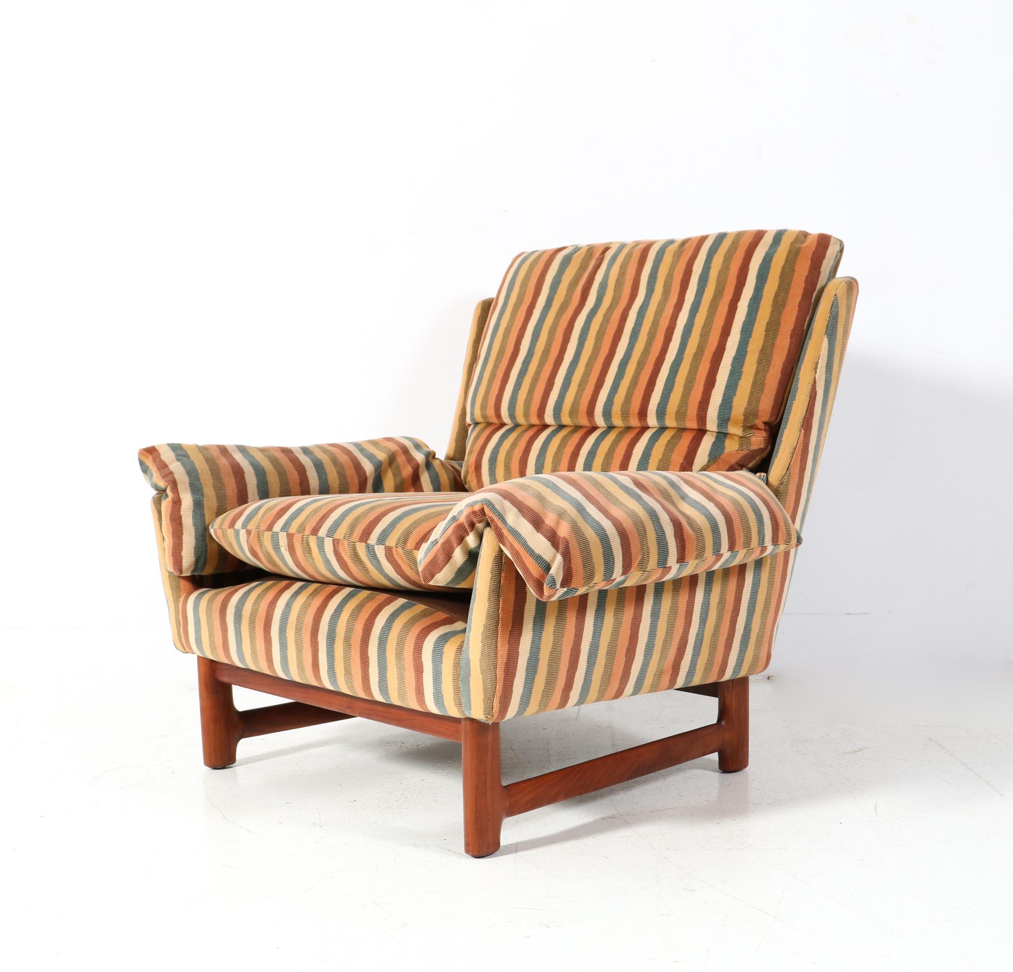 Stunning and elegant Mid-Century Modern club chair.
Striking Danish design from the 1970s.
Original solid teak frame which has been re-upholstered with a high quality multi-colored striped fabric by the former owner.
This wonderful Mid-Century