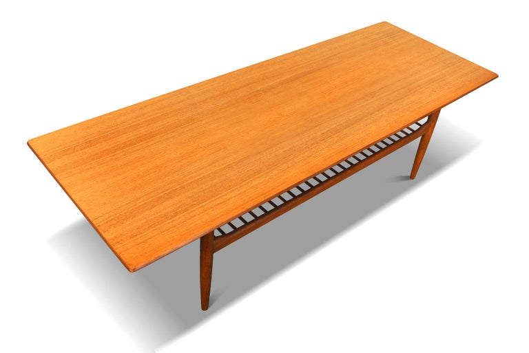 Mid Century Modern Teak Coffee Table With Lower Rack by Ib Kofod Larsen