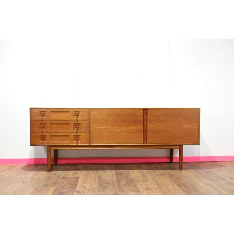 A beautifully designed & scarcely seen model of sideboard by the renowned manufacturer McIntosh of Kirkcaldy circa 1960s.  The craftsmanship and attention to detail in these sideboards is stunning. This model features unique drawer fronts and