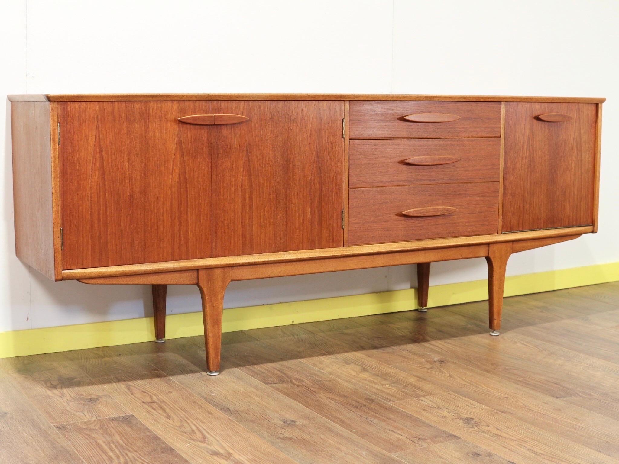 This gorgeous Mid-Century Modern credenza by Jentique is a fantastic piece of furniture. It oozes Danish style and has a fantastic grain in the wood to make it Stand out for the crowd.

With plenty of storage this is a really wonderful piece.