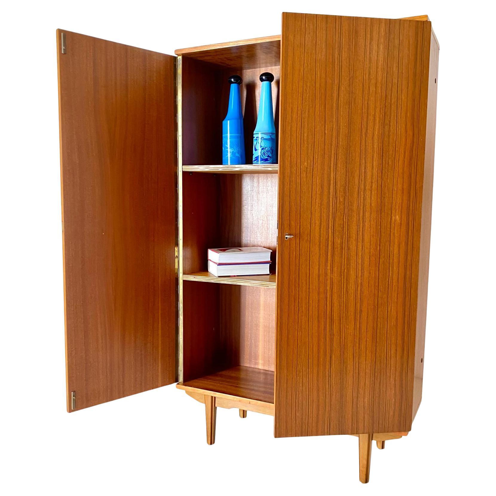 Mid Century Modern Teak Cupboard in Scandinavian Style, Italy 1960

Vintage teak cupboard manufactured in Italy in the 1960s by AV Arredamenti Contemporanei, The piece features a highboard structure made of rich teak, complemented by sturdy beech