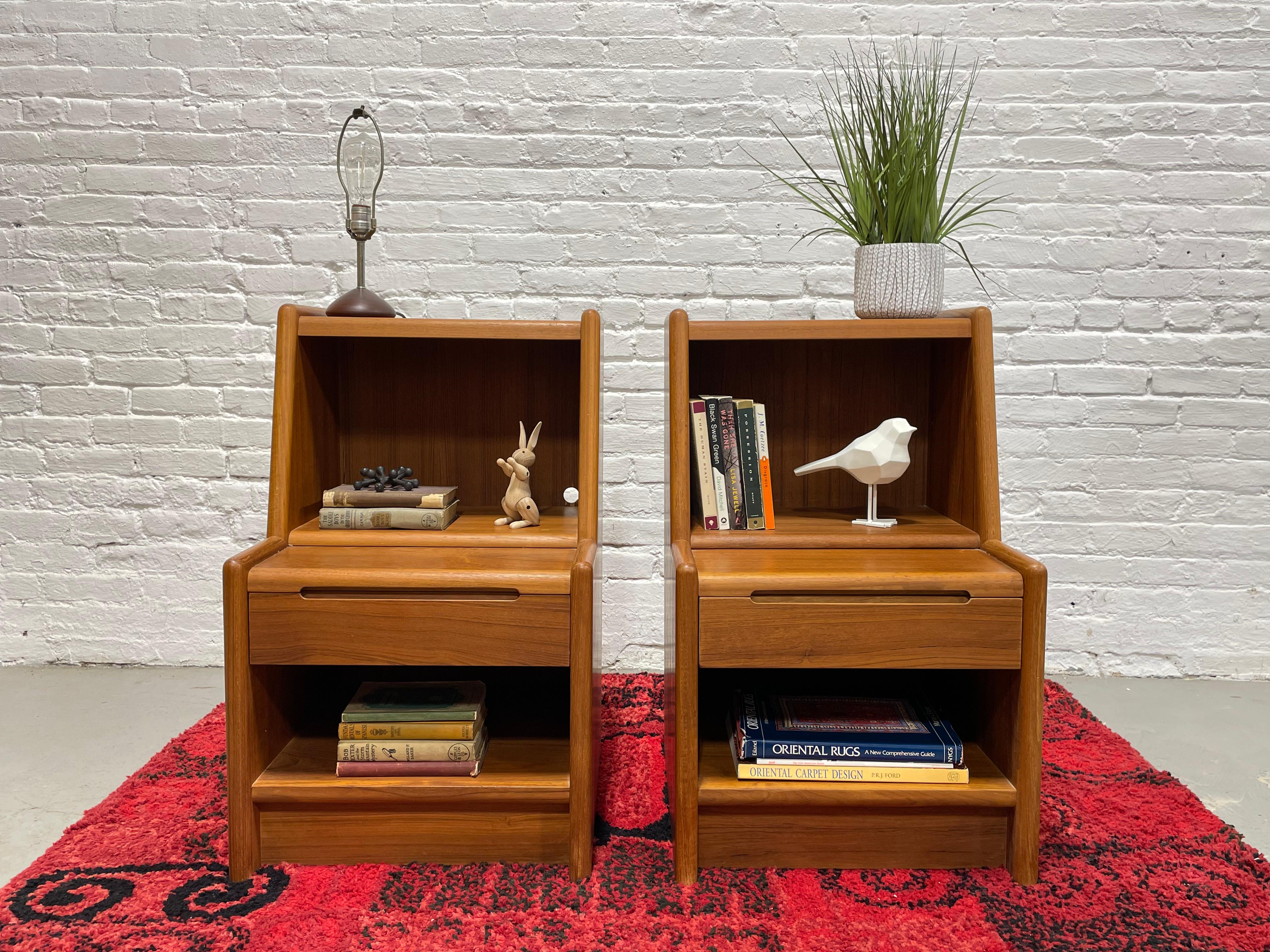 Mid Century Modern Teak Nightstands, Made in Denmark, c. 1960's.  This incredible pair offer loads of storage space - open cubby area above and below, a unique built-in drawer, perfect for storing private items and a hidden tabletop area that pulls
