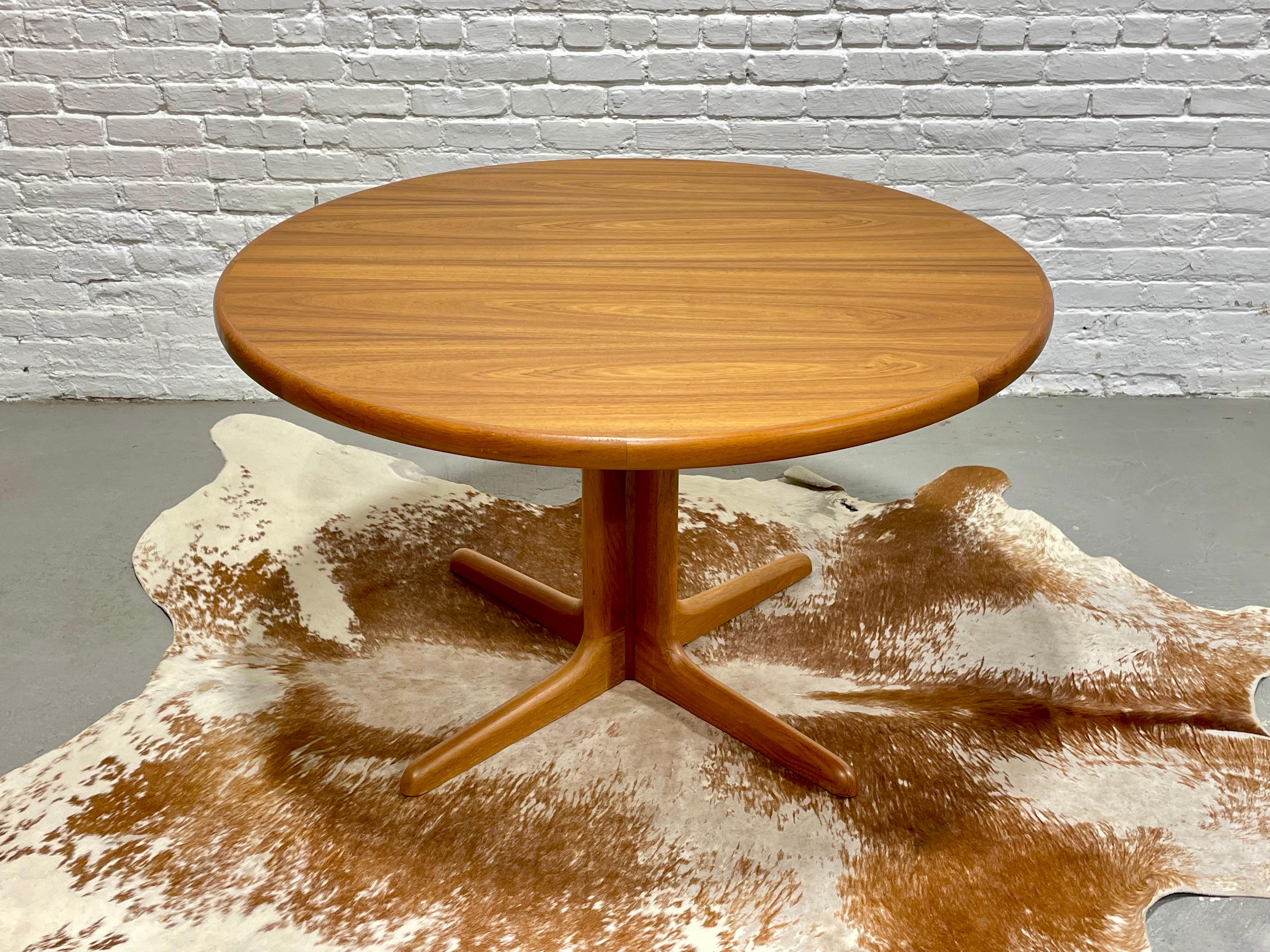 Mid Century Modern Teak Round Dining Table by Skovby, Made in Denmark. The table has stunning wood grains and is in incredible vintage condition - appears to have never been used. Easily seats 4 but given the round shape, you can squeeze in another