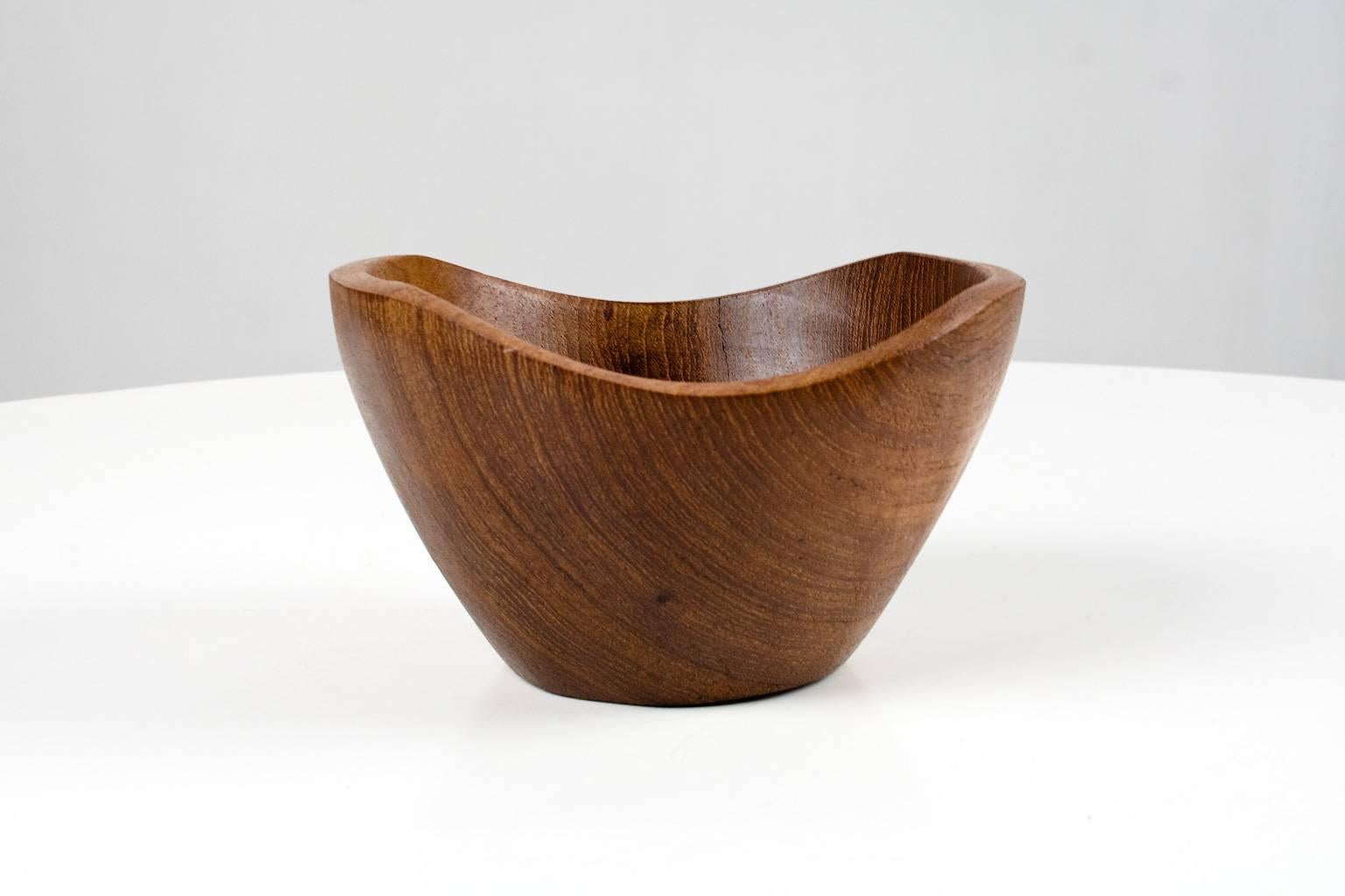 Mid-Century Modern Danish hand moulded and sculptural, asymmetrical teak bowl in very good condition. Bought in the early 1960s in Denmark, Scandinavian Modern design. The piece is in good condition, one small dent of approx. 1cm, as shown on photo.