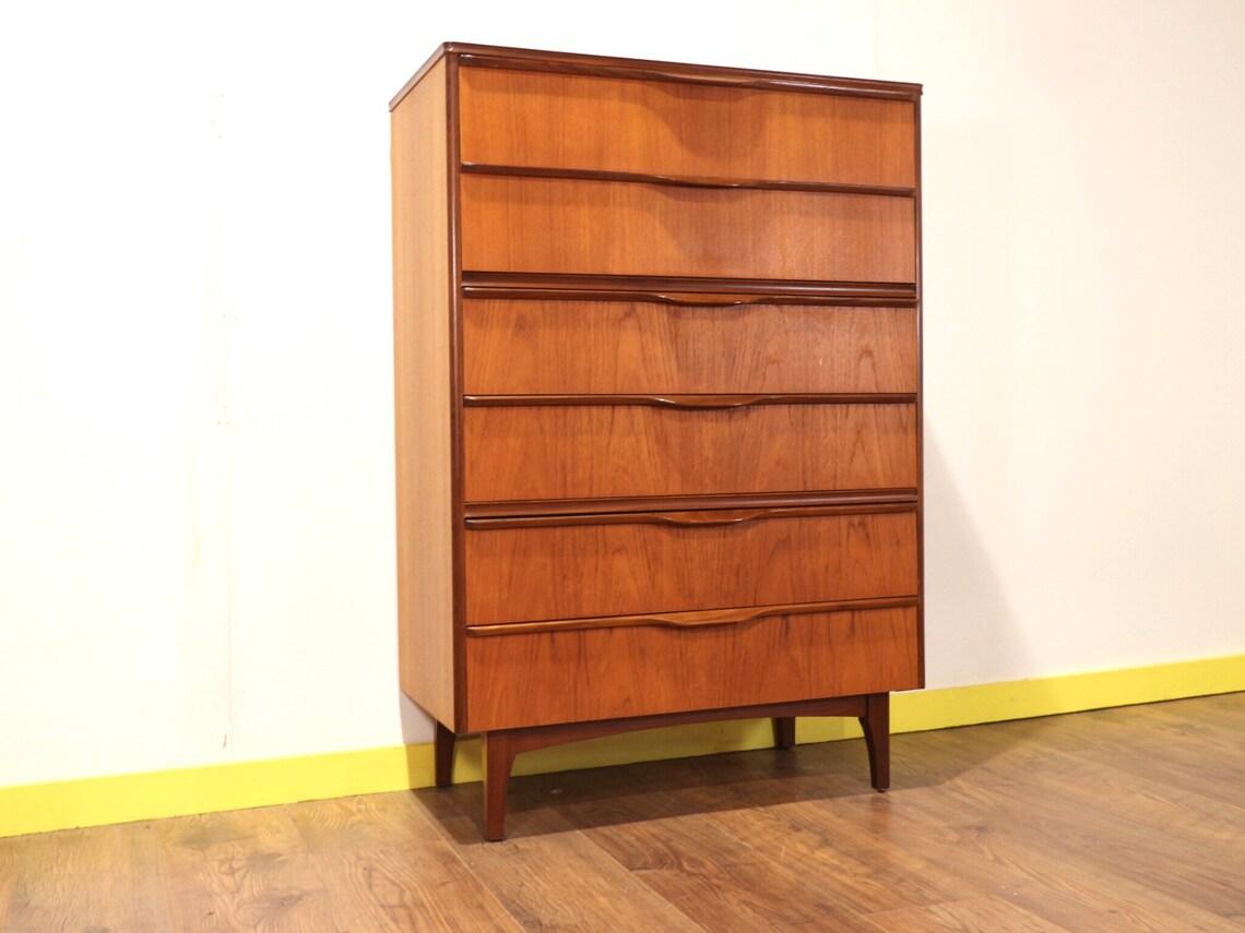 A beautiful and stylish tall boy dresser featuring 6 good sized drawers with stunning handles. This dresser oozes Danish style and would look fabulous in any surroundings.

Dims
w31 d16 h45

Condition
This dresser is in great all round