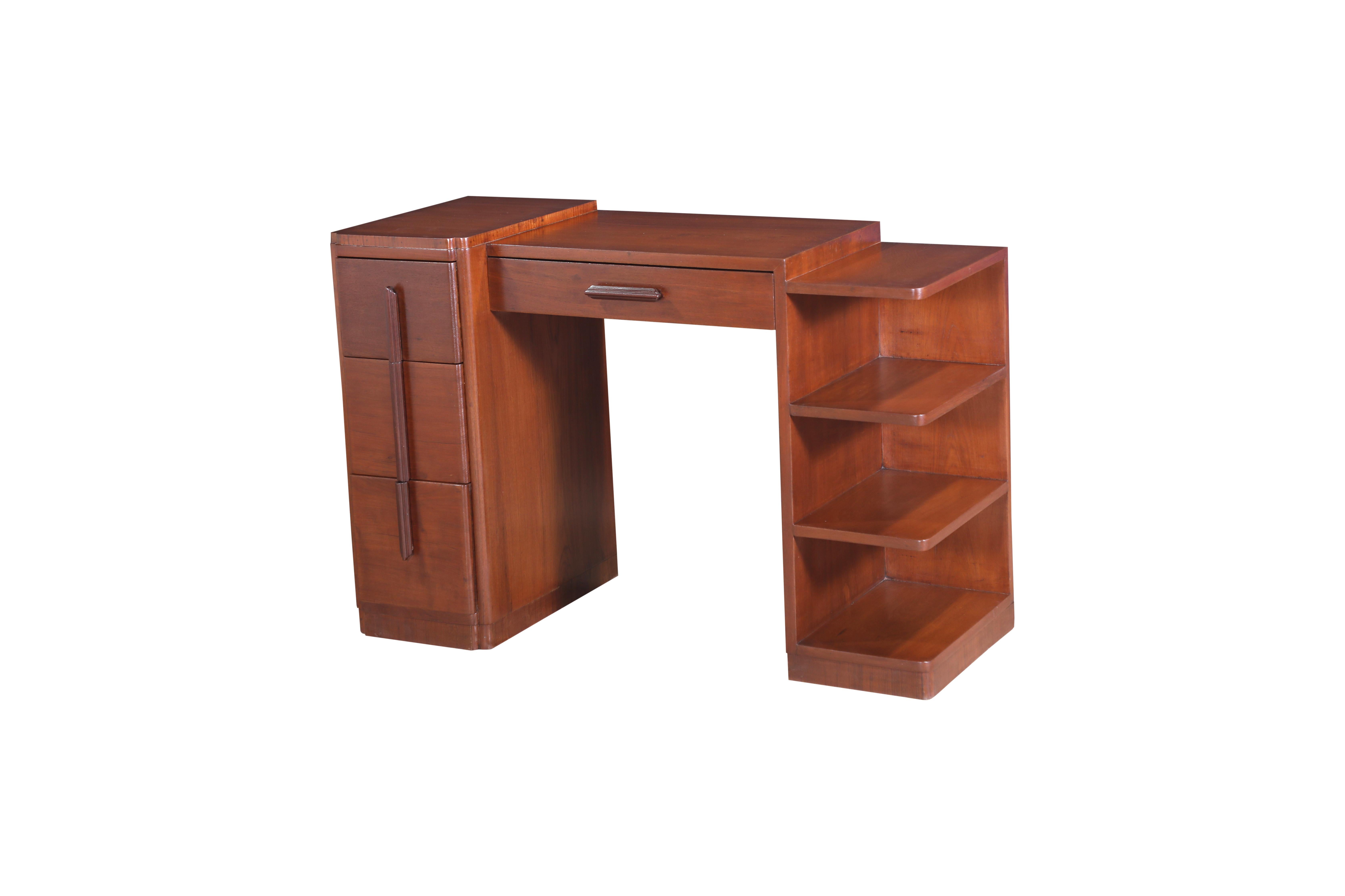 A handsome and finely crafted mid-Century Modern solid teakwood desk.  It features a set of three drawers on the left side, drawer in the middle, and open shelves on the right.  The top is slightly stepped, the leftside being 31