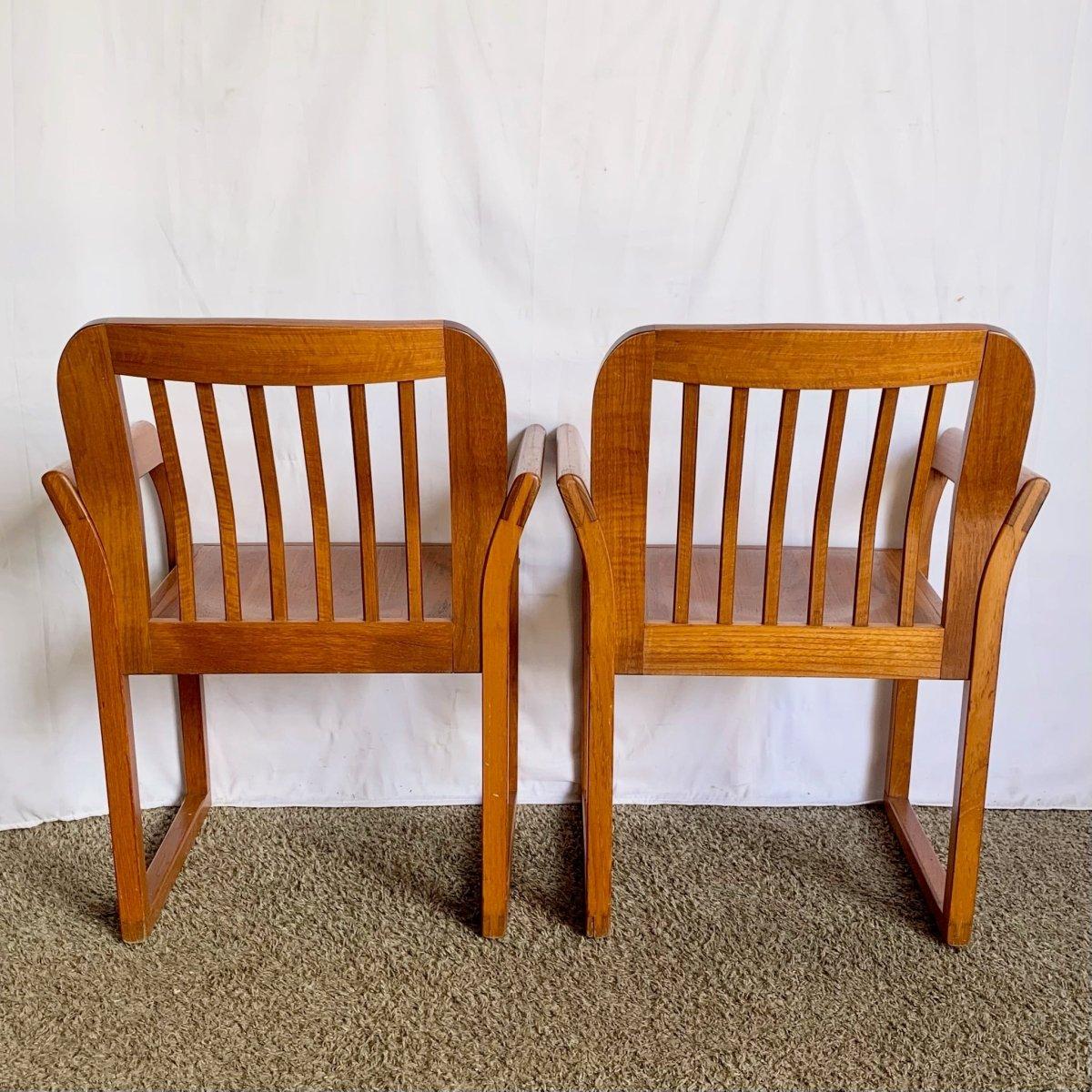Midcentury Teak Dining Arm Chairs Set Of 4 blends sculptural armrest design, warm teak grain, and plush upholstery into a sophisticated dining ensemble.
 

 Some wear as shown and some of the caps have been covered with spears to be a wood filler.
