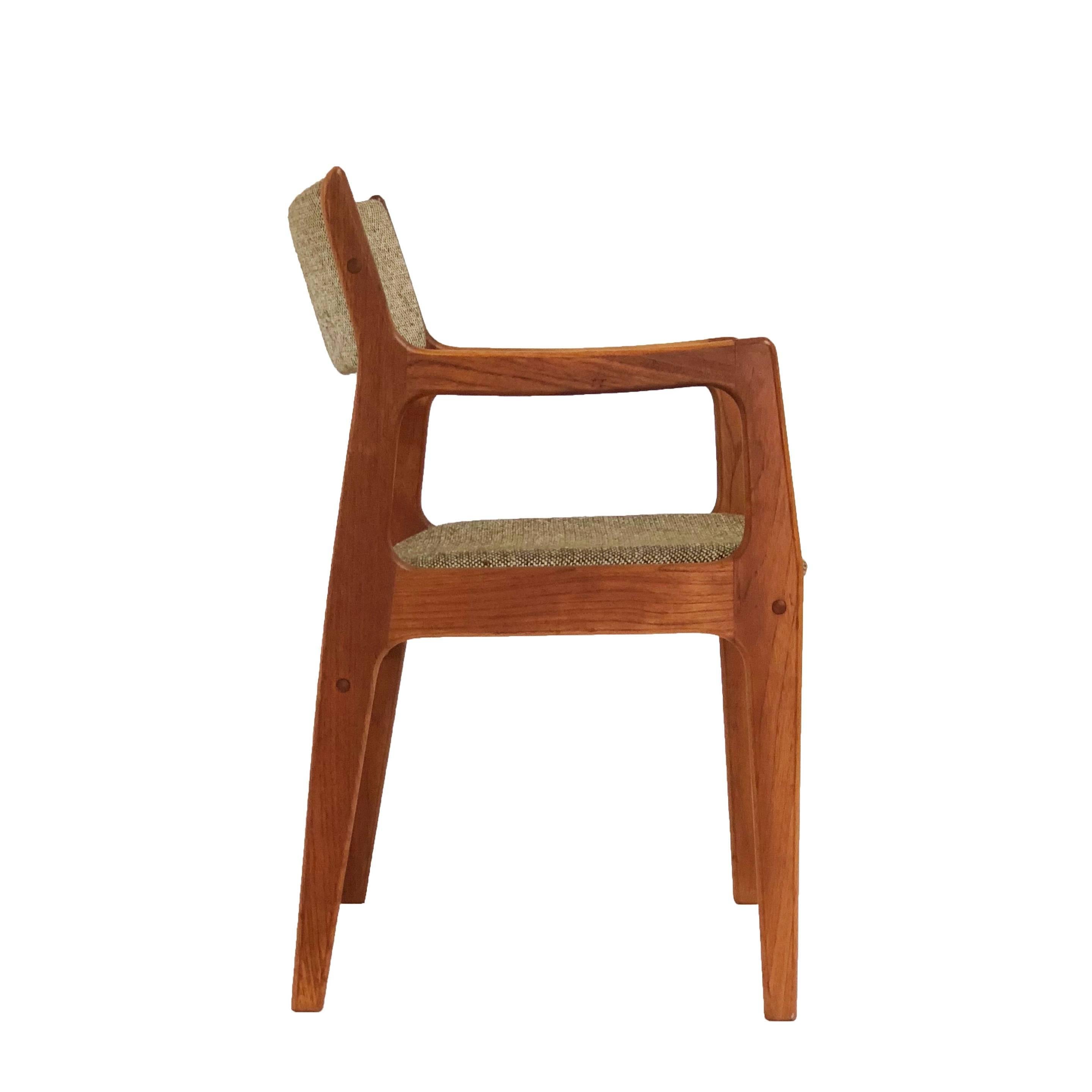 Mid-Century Modern teak dining chairs by Dixie Furniture Co. Frames are in excellent condition and fabric is in good condition. There are four side chairs and two captains chairs. Age appropriate wear. Please contact for shipping