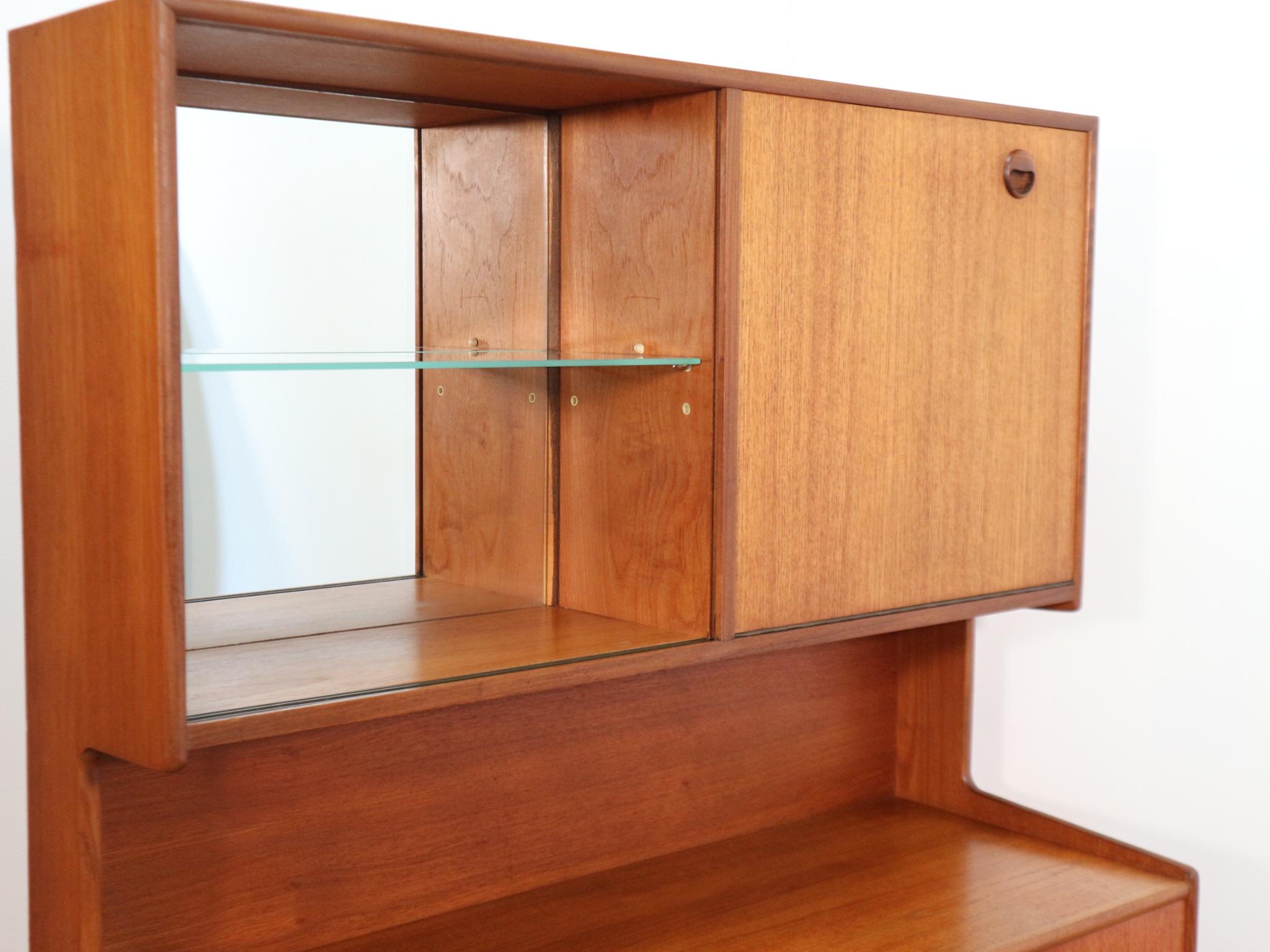 This mid century teak display cabinet with Danish design influence and manufactured by Turnidge of London in late 60's would make a fabulous addition to any space, it's unusal design makes it a stand out and can be used for a variety of uses.