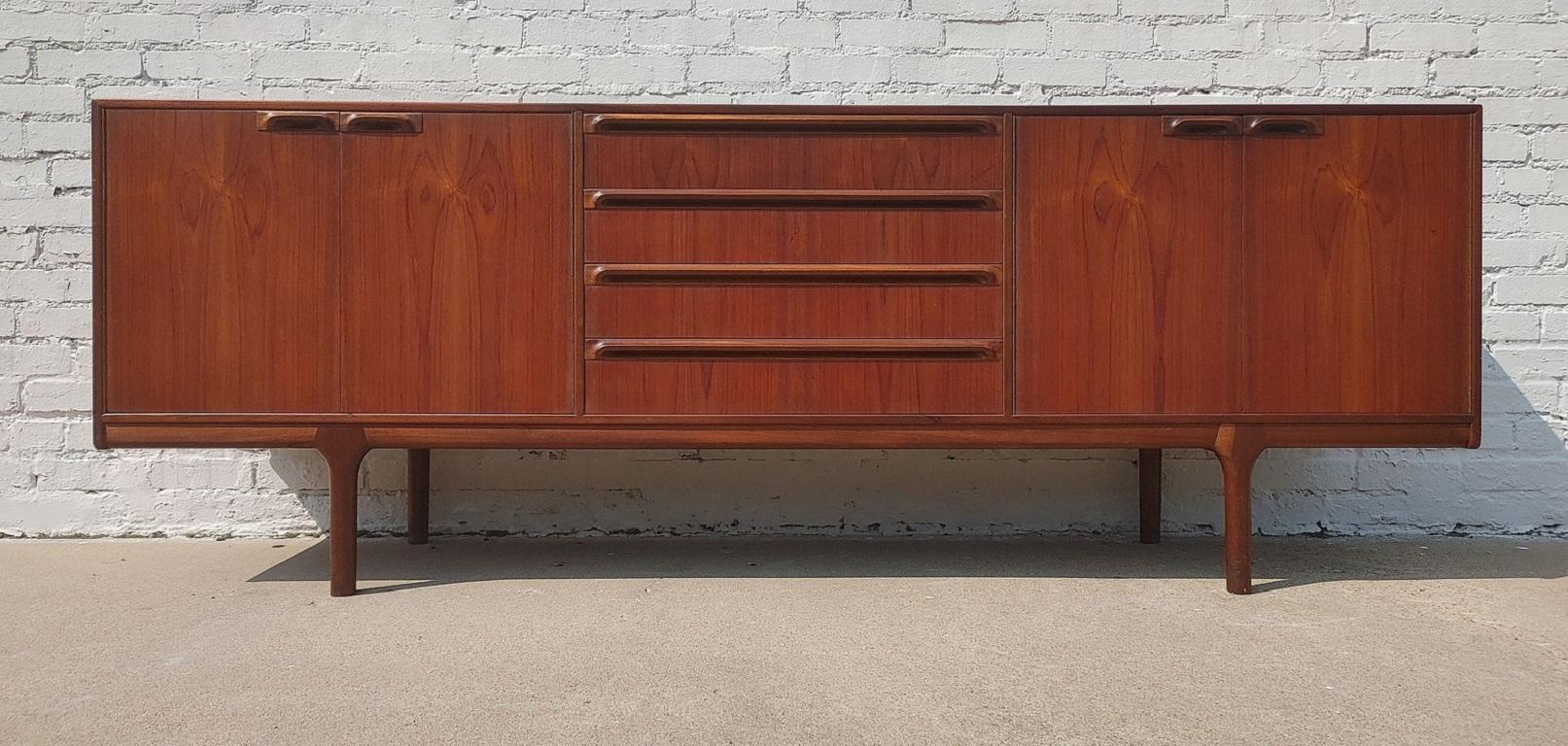 Mid Century Modern Teak English Sideboard by McIntosh

Above average vintage condition and structurally sound. Has some expected finish wear and scratching. Has dings on several edges. Please zoom on the listing pics. Outdoor listing pictures might