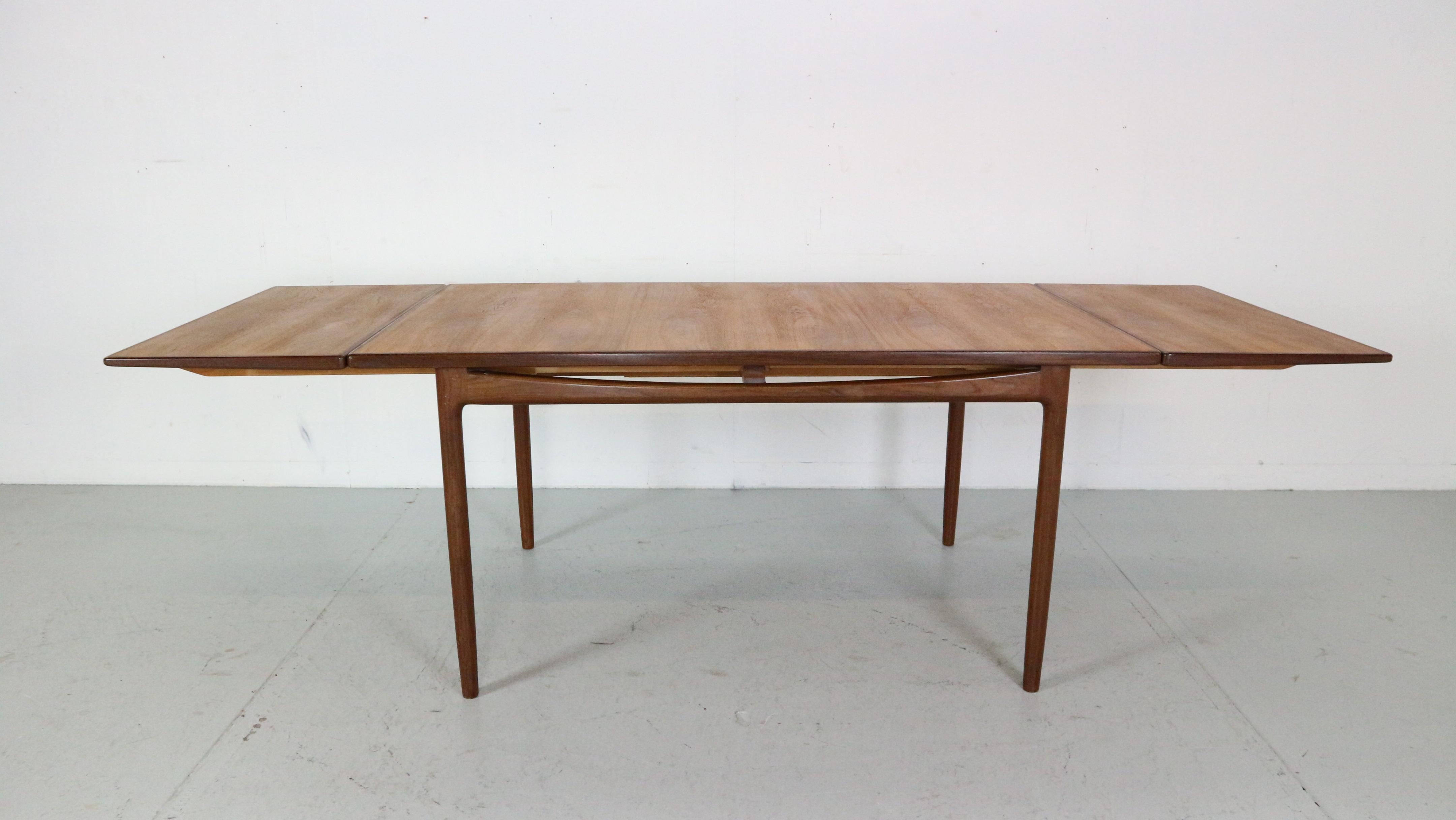 Mid- Century modern period dining room table from the acclaimed 