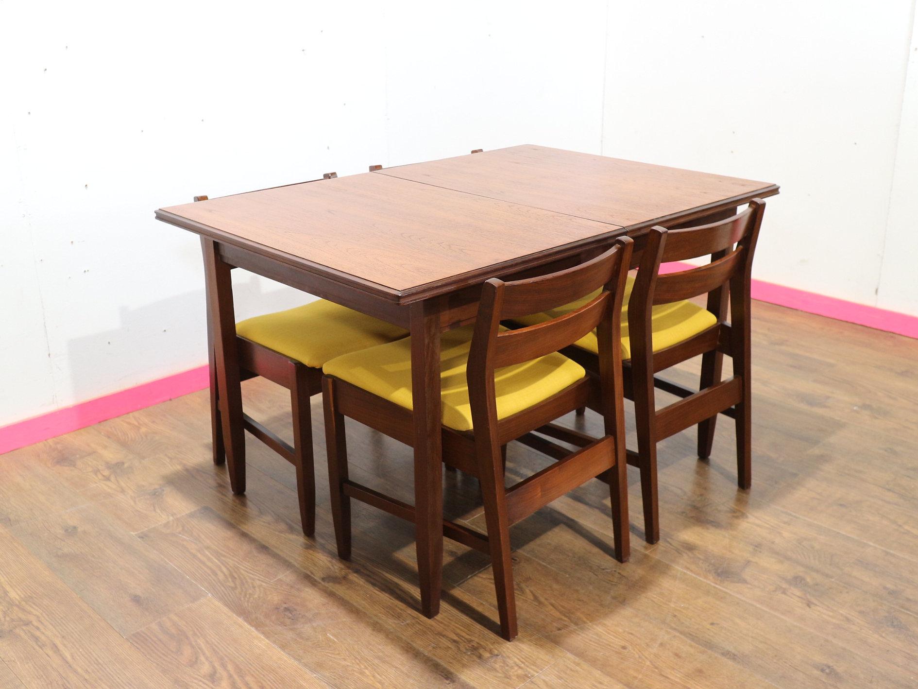 Discover timeless elegance with our Mid Century Modern Vintage White and Newton Extending Dining Table and 4 Chairs, available at Mid Century Traders. This gorgeous dining table and chair set by renowned British furniture maker, White and Newton,