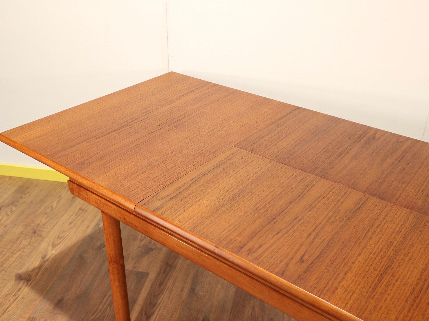 extending teak dining table