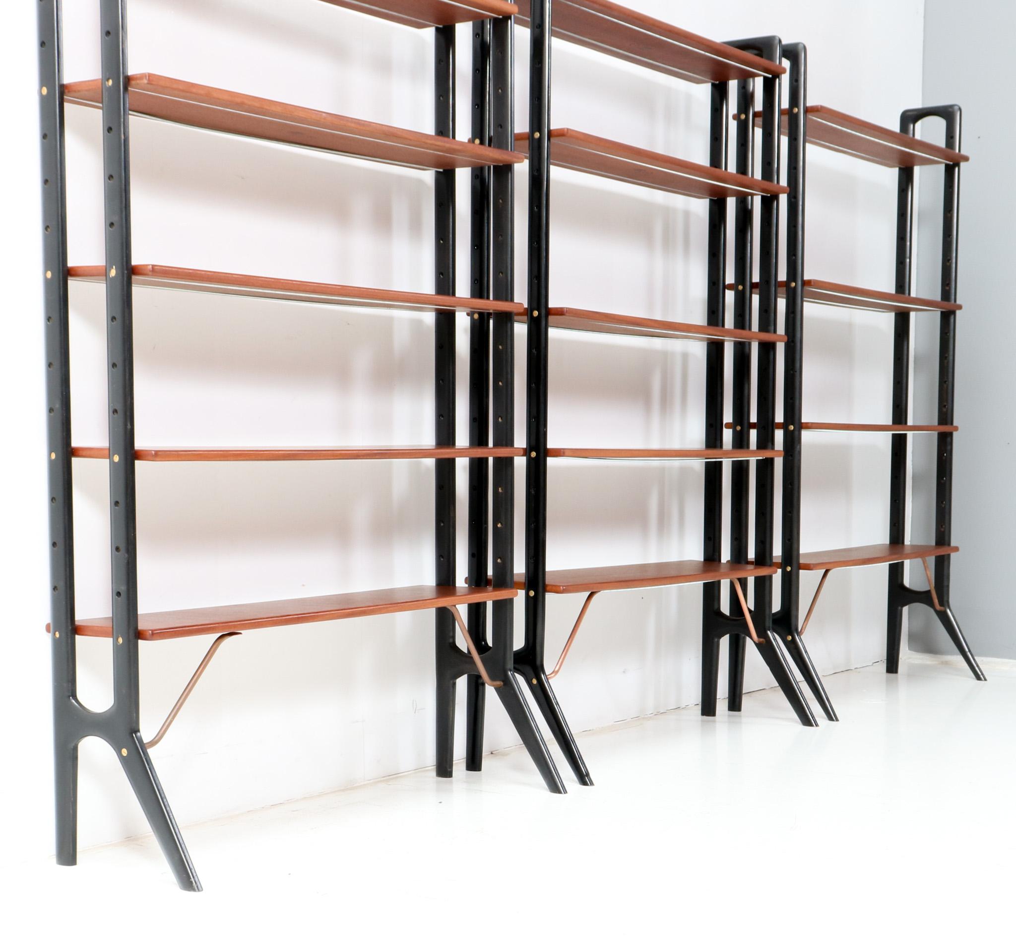 Three stunning Mid-Century Modern free standing shelving units.
Design by Kurt Østervig for KP Mobler Furniture Company.
Striking Danish design from the 1960s.
Two units have two black lacquered wooden uprights with five original teak veneered