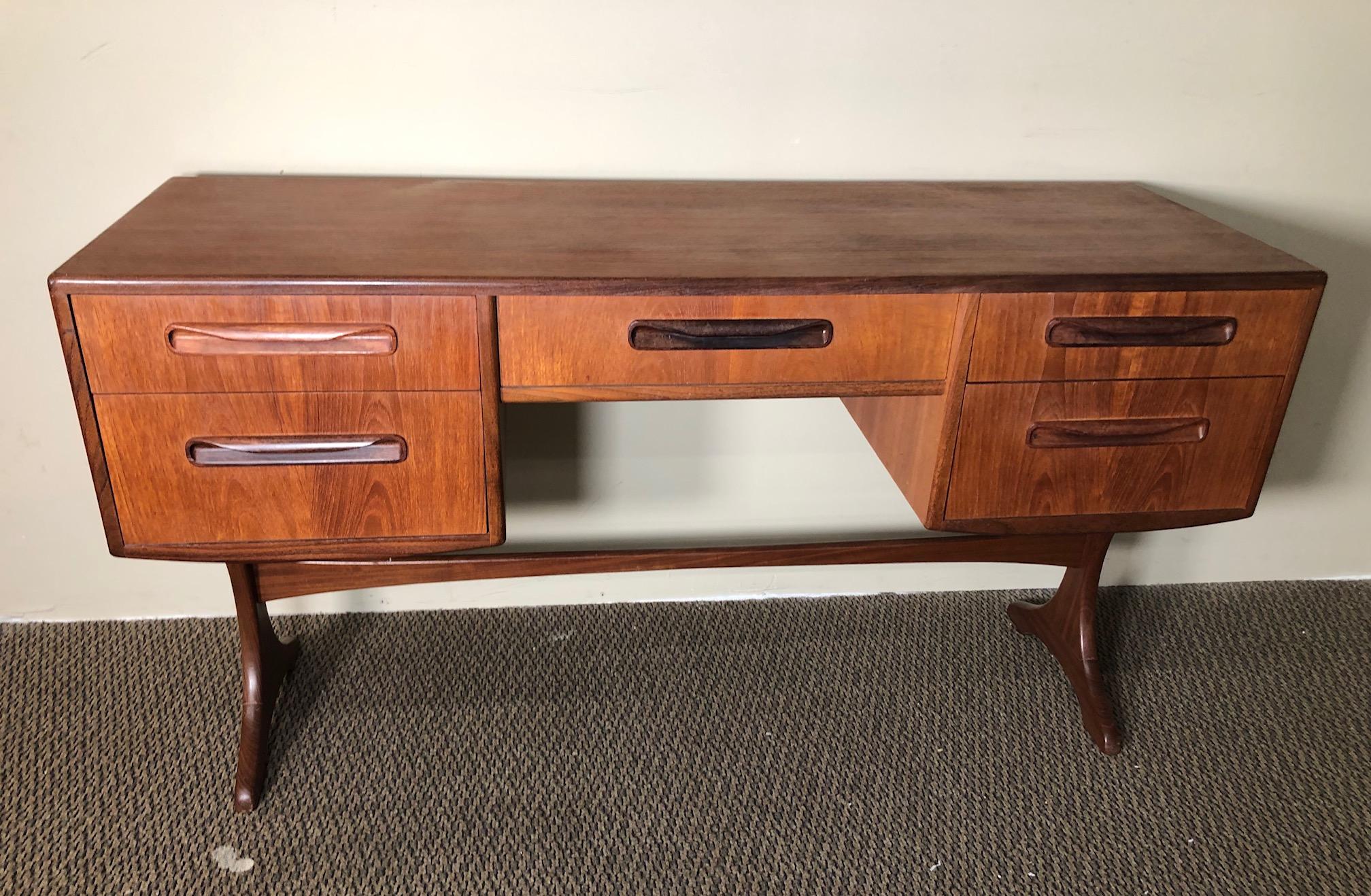 Fantastic midcentury teak vanity or desk. Designed in the 1960s by Victor Bramwell Wilkins for G Plan's Fresco Range.
Very good vintage condition. All the drawers glide well. Original G Plan sticker in the top drawer. The back is