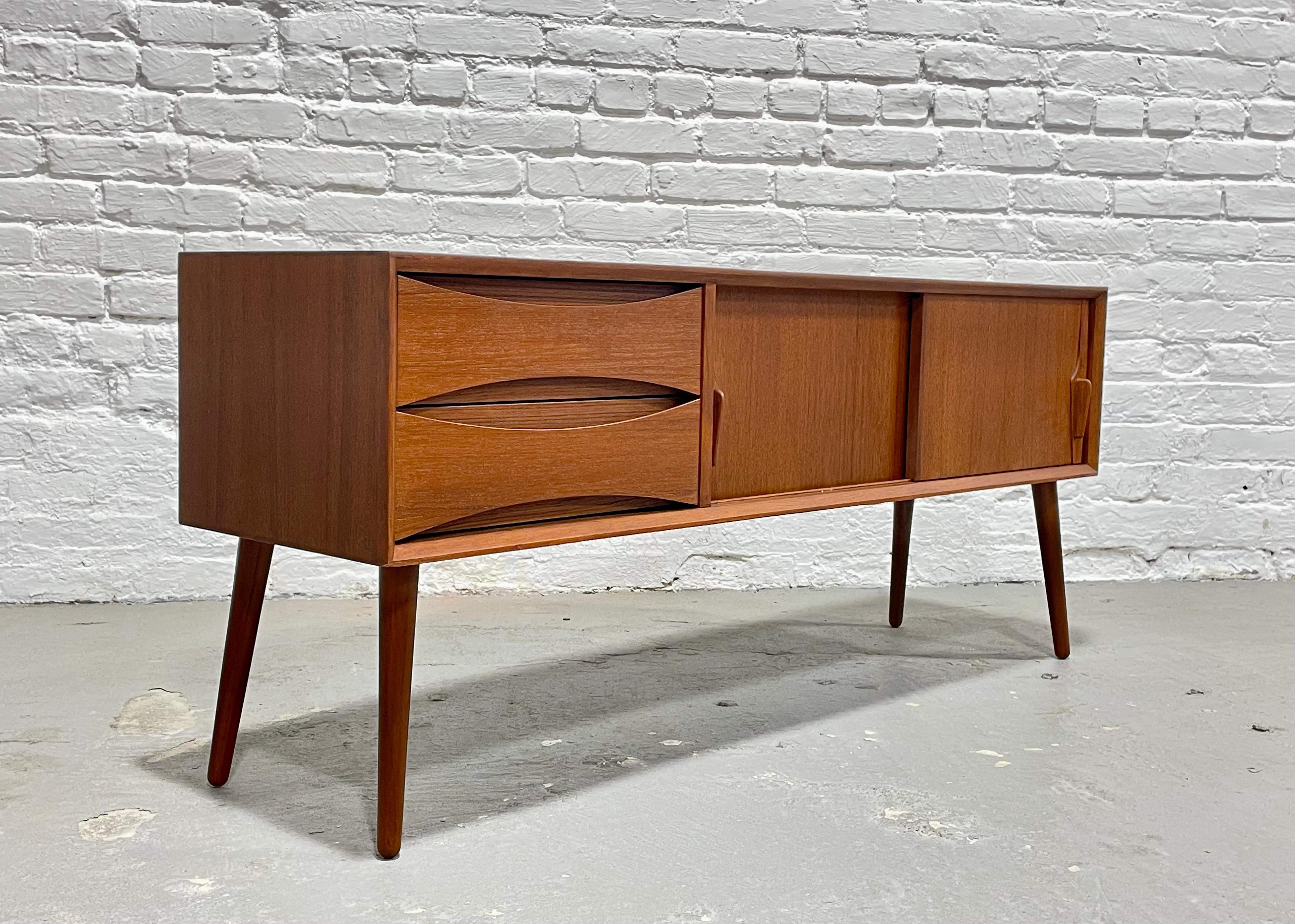 Mid-Century Modern styled Petite Credenza / console in a perfectly tailored extra small apartment Size. Please confirm measurements - the piece is smaller than it appears in the pictures and is NOT a full Size credenza. This lovely piece has two