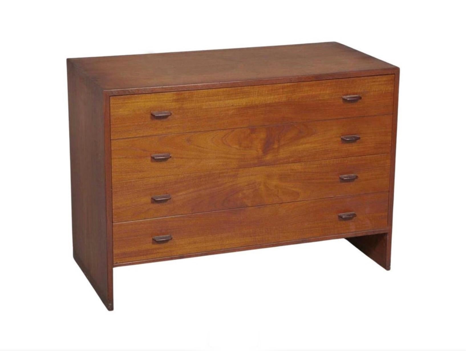 This Danish teak chest of drawers was designed by Hans J. Wegner in the 1950s. This 4 drawer dresser features great details of craftsmanship and shows a beautiful wood grain. Great vintage condition. Labeled on Back side. Made in Denmark. Located in