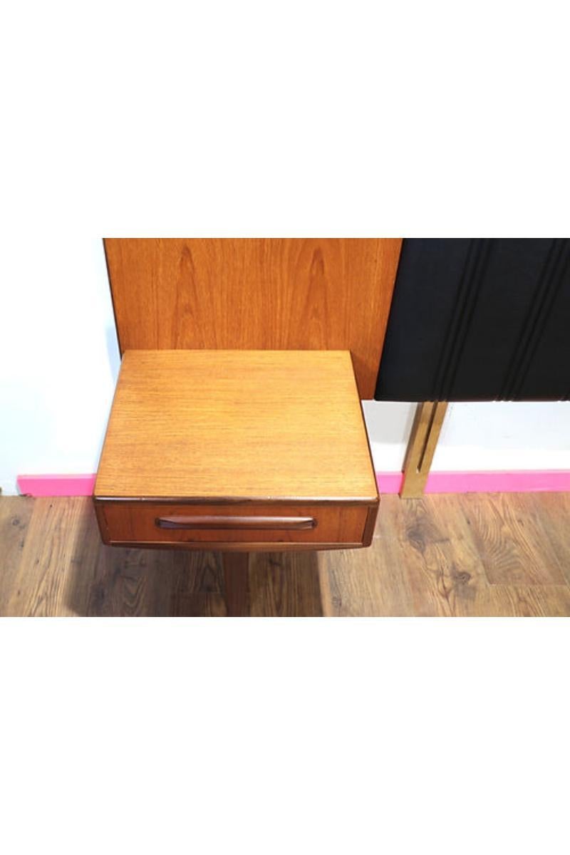 This beautiful G Plan headboard is a fantastic example of mid century style. With pure elegance of form and simplicity of structure this piece will transform your bed into a modernist's dream.

Elegant geometry, beautifully grained teak and