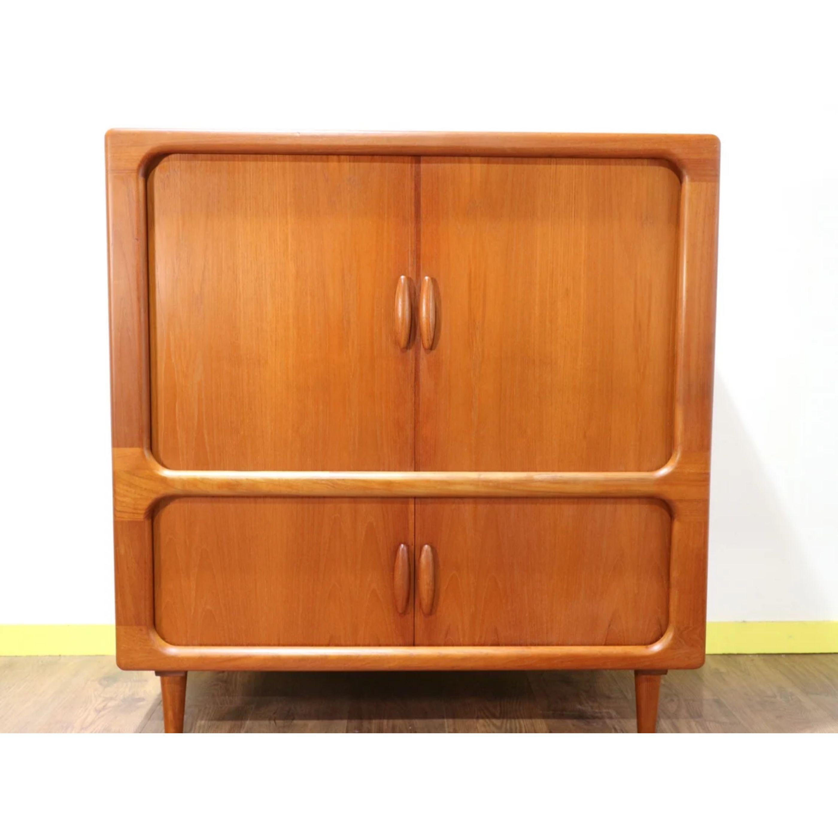A truly stunning mid-century Danish cabinet by Dyrlund. This is a superb quality piece of furniture. The tambour doors really set this cabinet apart from the rest and the whole cabinet oozes Danish mid-century style.

Dimension:

W 41.5 D 21.5 H