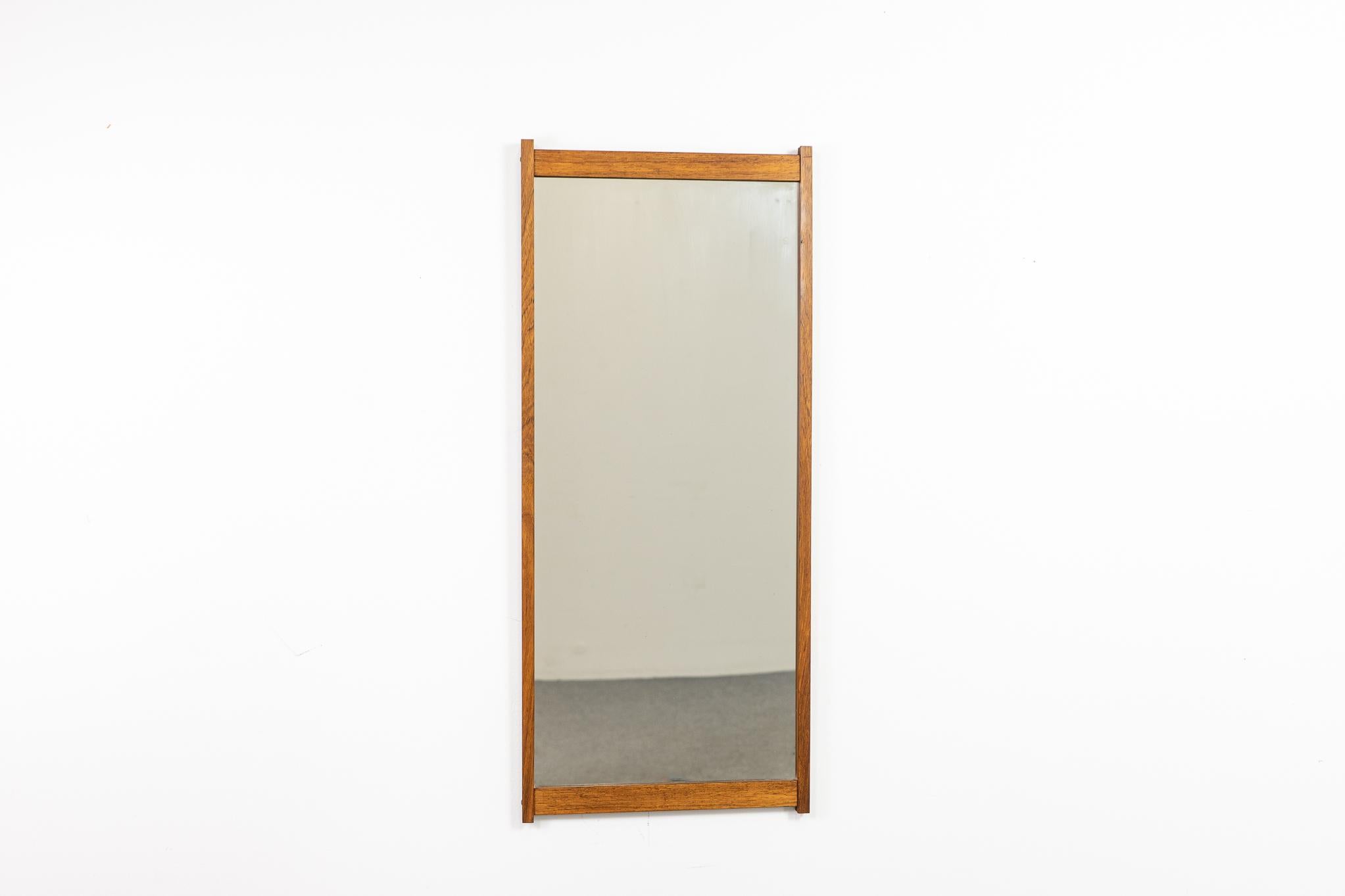 Teak mid-century mirror, circa 1960's. Warm tone, stunning grain and patina, original glass. Clean compact design, not your average rectangle!

Please inquire for international and remote shipping rates.