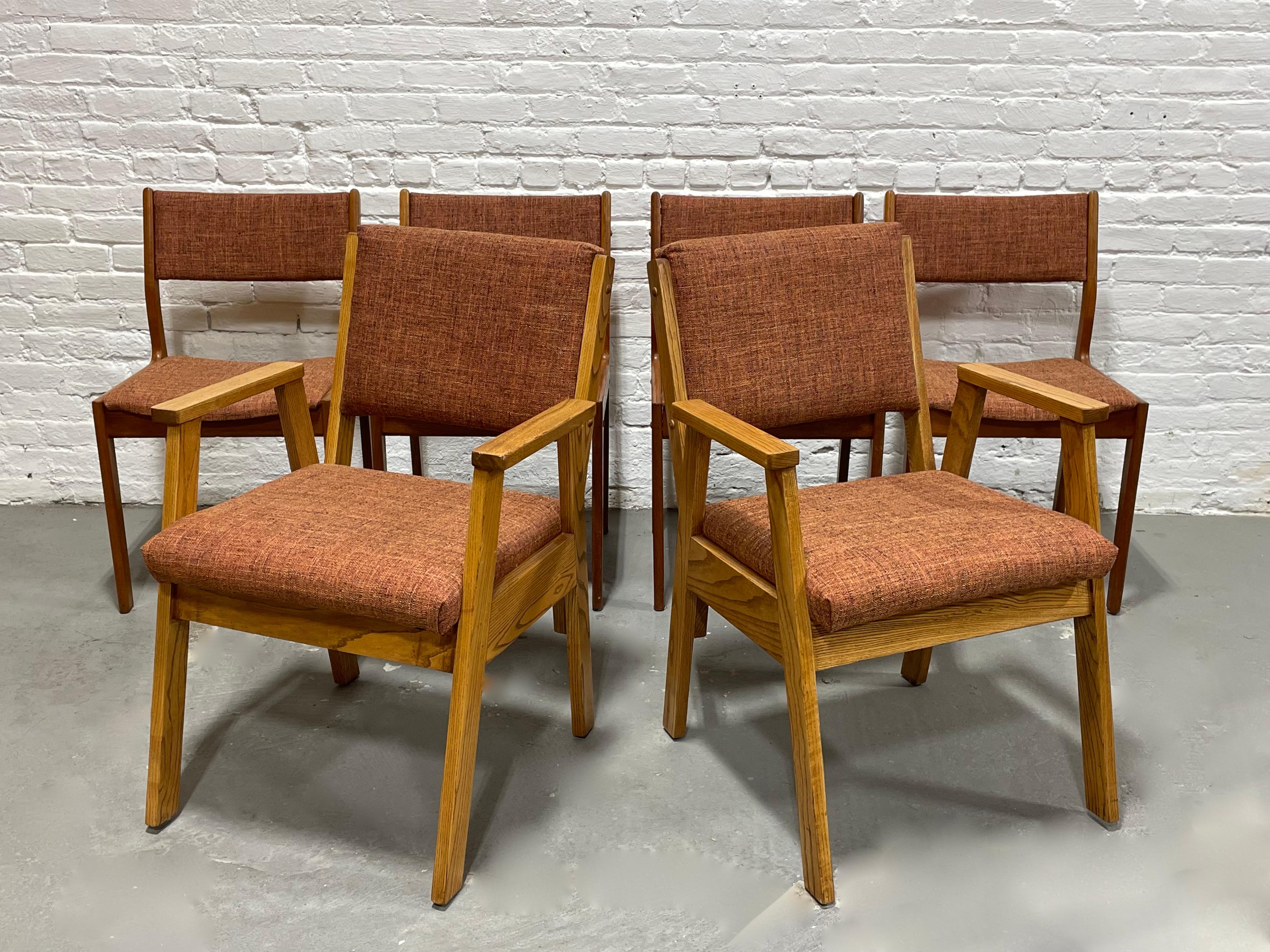 Mid Century Modern Dining Chairs, Set of 6, c. 1960's. This set is upholstered in the most beautiful orangey upholstery and consists of four Danish teak side chairs as well as a pair of solid oak armchairs.  While the upholstery is the same across