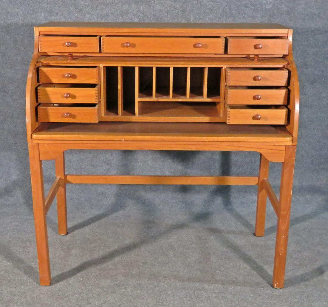 A beautiful vintage teak desk, featuring a roll up door revealing generous storage compartments and several drawers. Please confirm item location with seller (NY/NJ).