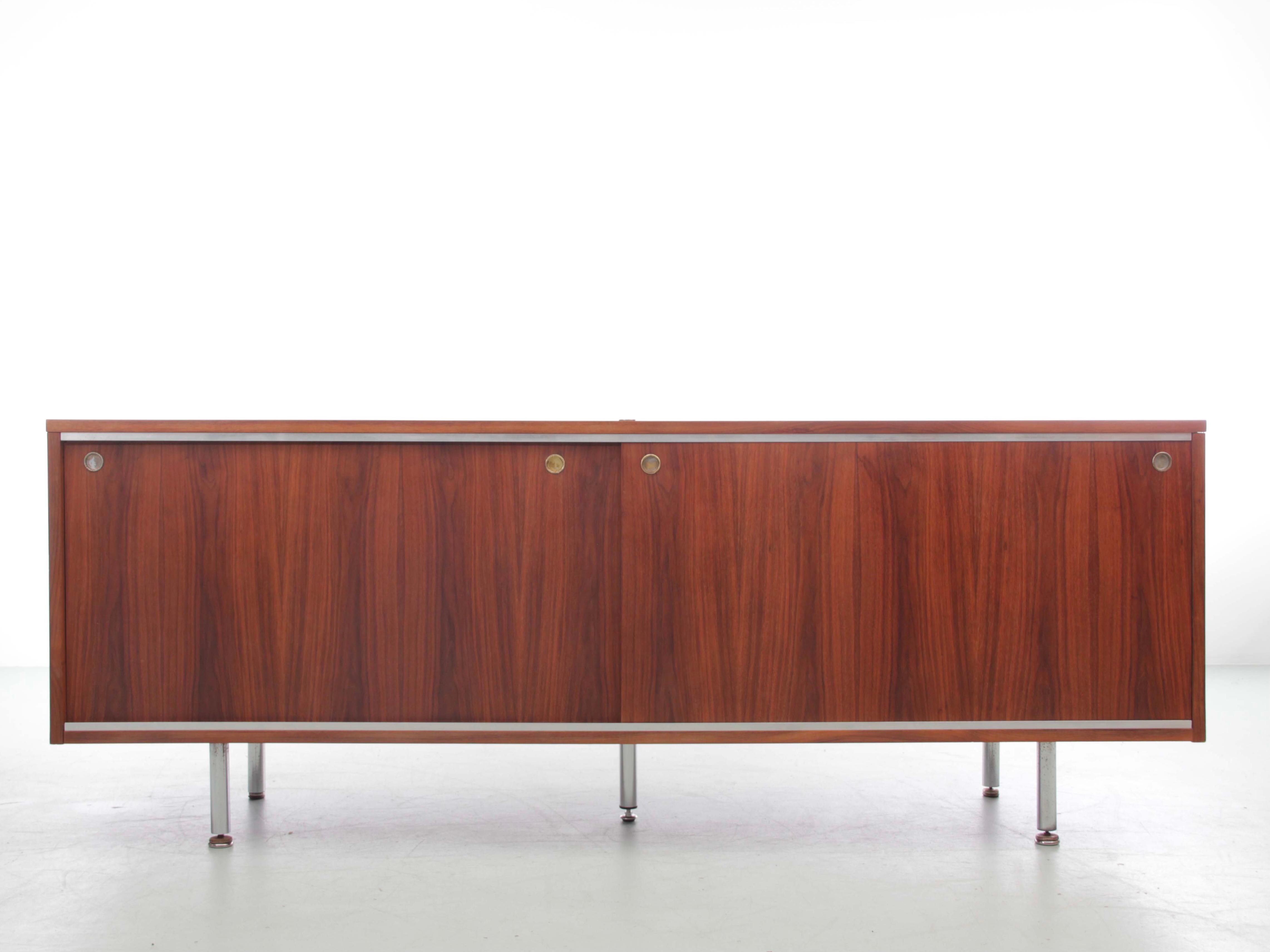 Teak sideboard by George Nelson for Herman Miller, 2 sliding doors, tubular chromed metal legs. Some scratches and repair.