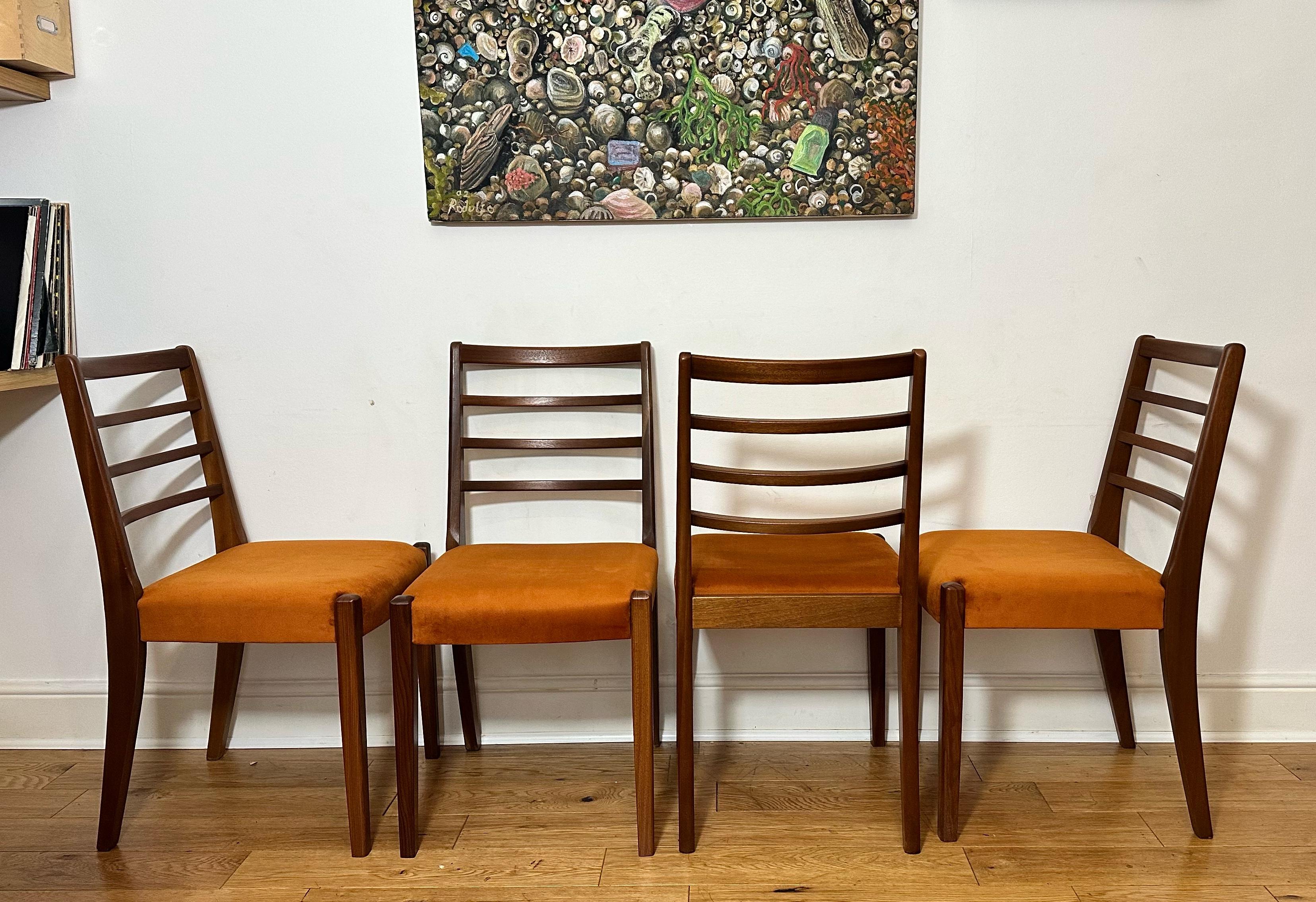 Beautiful, top quality mid-century set of six ladder back Danish chairs. Very stylish Scandinavian design with rich golden teak grain and super comfortable seats. Frames have been cleaned and wax polished. Immaculate, near new condition, these