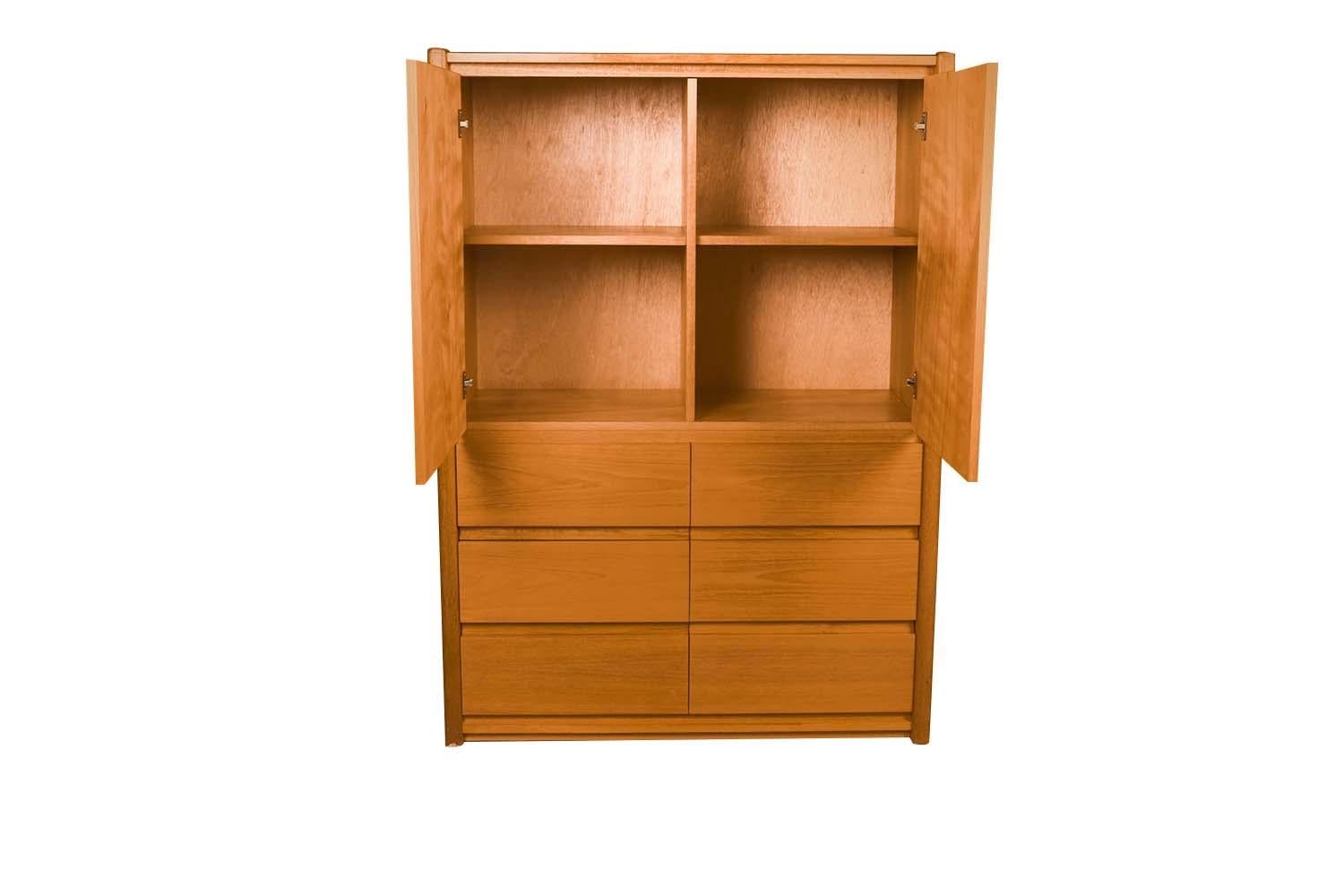 Vintage, midcentury teak double door cabinet. This stunning cabinet with its clean unadorned style is a beautiful example of modern furniture. Features an upper cabinet with double doors that open to reveal ample storage space with two removable