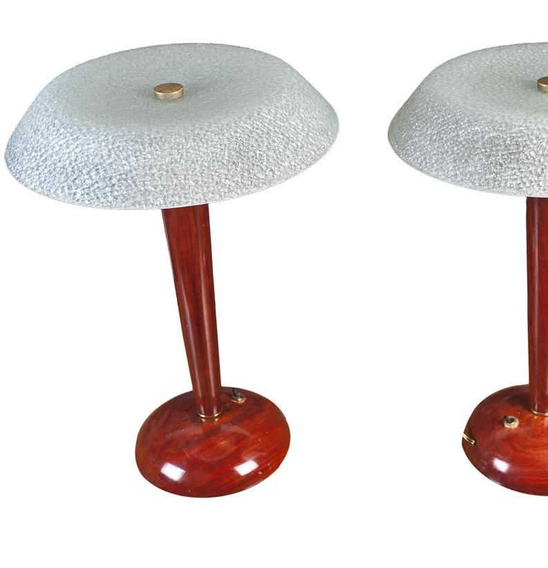 A pair of Mid-Century Modern teak table lamps with textured, frosted shades. European but wired for American use. Each lamp takes two candelabra type bulbs. Base diameter is 8.5