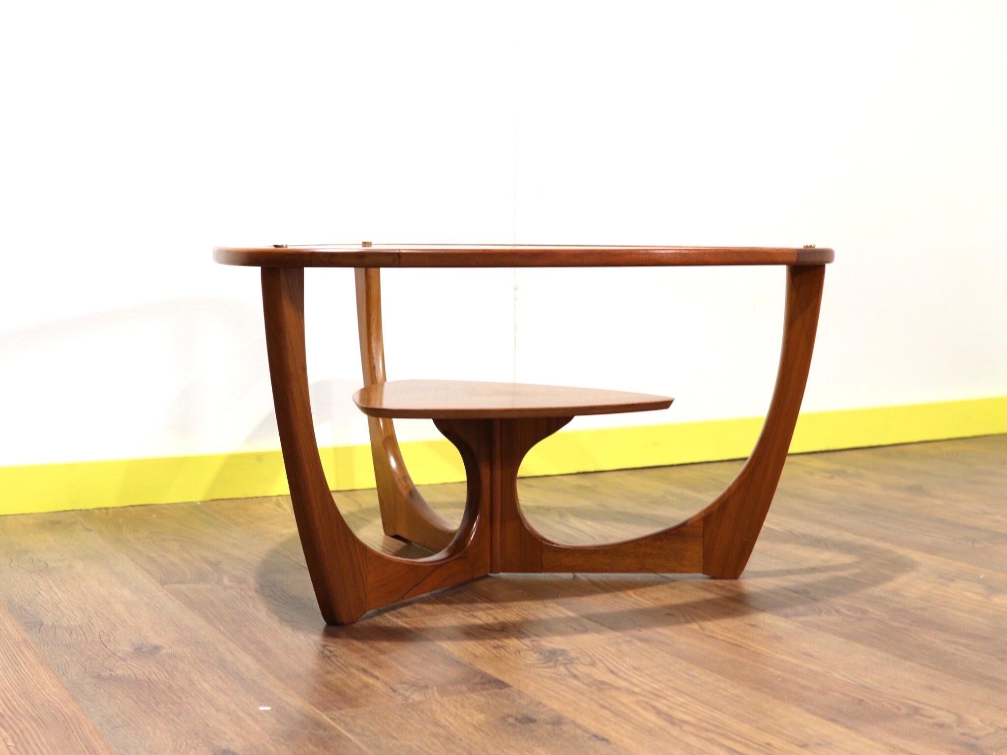 A beautiful example of mid century style that that would look great in any living space. This rare teak coffee table with gorgeous lines shout mid-century style.