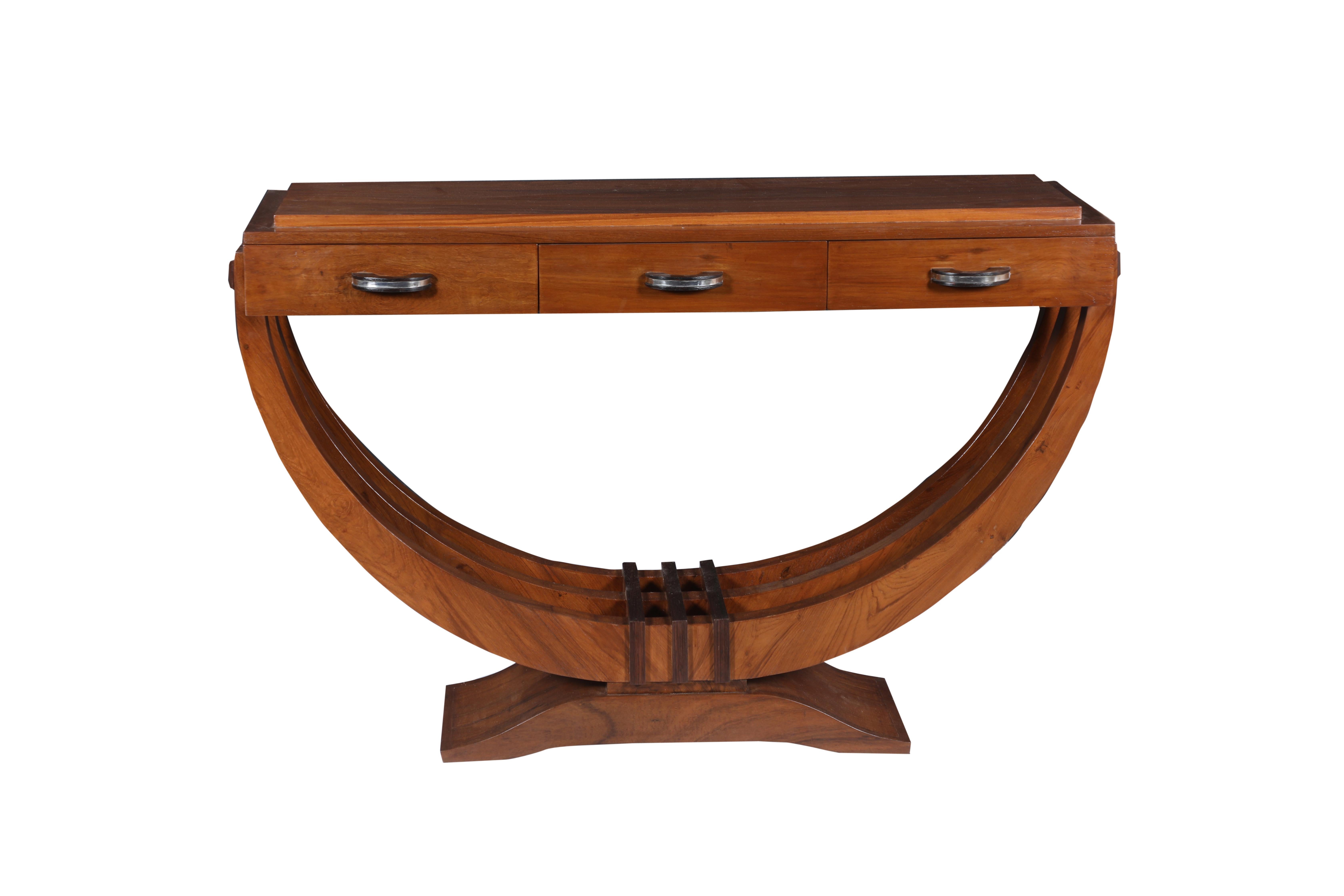 Elegant Mid-Century Modern teak U-shaped console or behind the sofa table. Three sweeping supports rest on a curved teak base with walnut details at the bottom and sides. Three front drawers with chrome and walnut drawer pulls. Refinished to an
