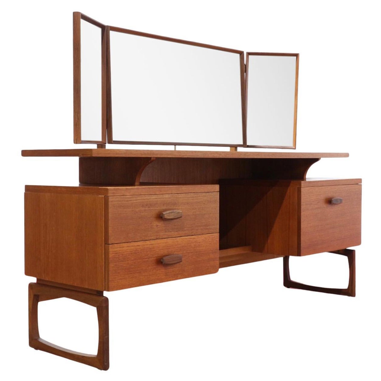 A truly stunning mid century vanity by G Plan as part of the Quadrille range. This fantastic piece of furniture can be used as it was originally designed as a vanity with its triple adjustable mirrors and drawers or it can also be used as a desk;