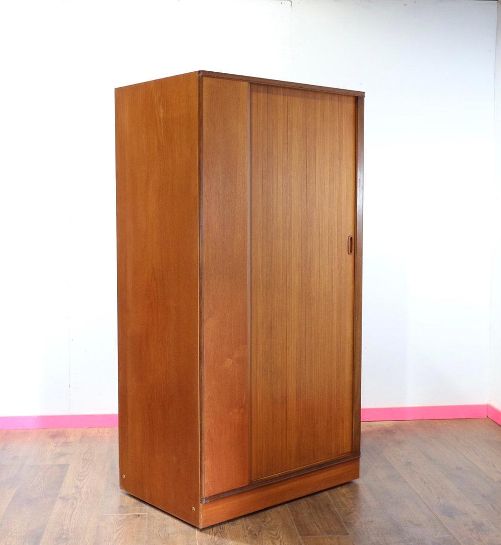 Introducing the stunning Mid Century Modern Vintage Armoire Teak Wardrobe by Austinsuite, a timeless piece that will elevate any bedroom or living space. Crafted by the renowned British furniture maker, Austinsuite, this armoire boasts impeccable