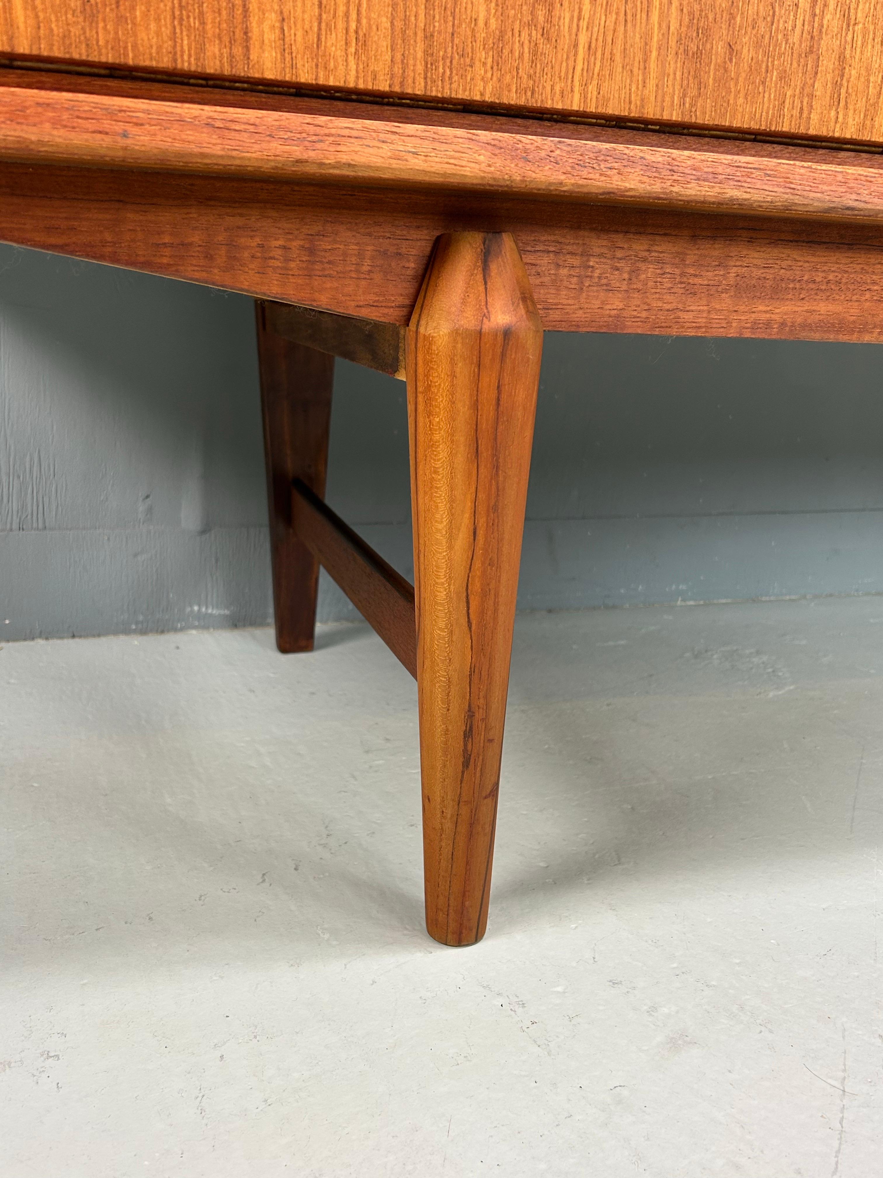 Mid- Century modern period Danish design sideboard made in 1960s, Denmark.

Elegantly curved details all around the sideboard represents high quality Danish design.
It's made of teak solid and veneered wood. In a good condition, 

Three drawers a