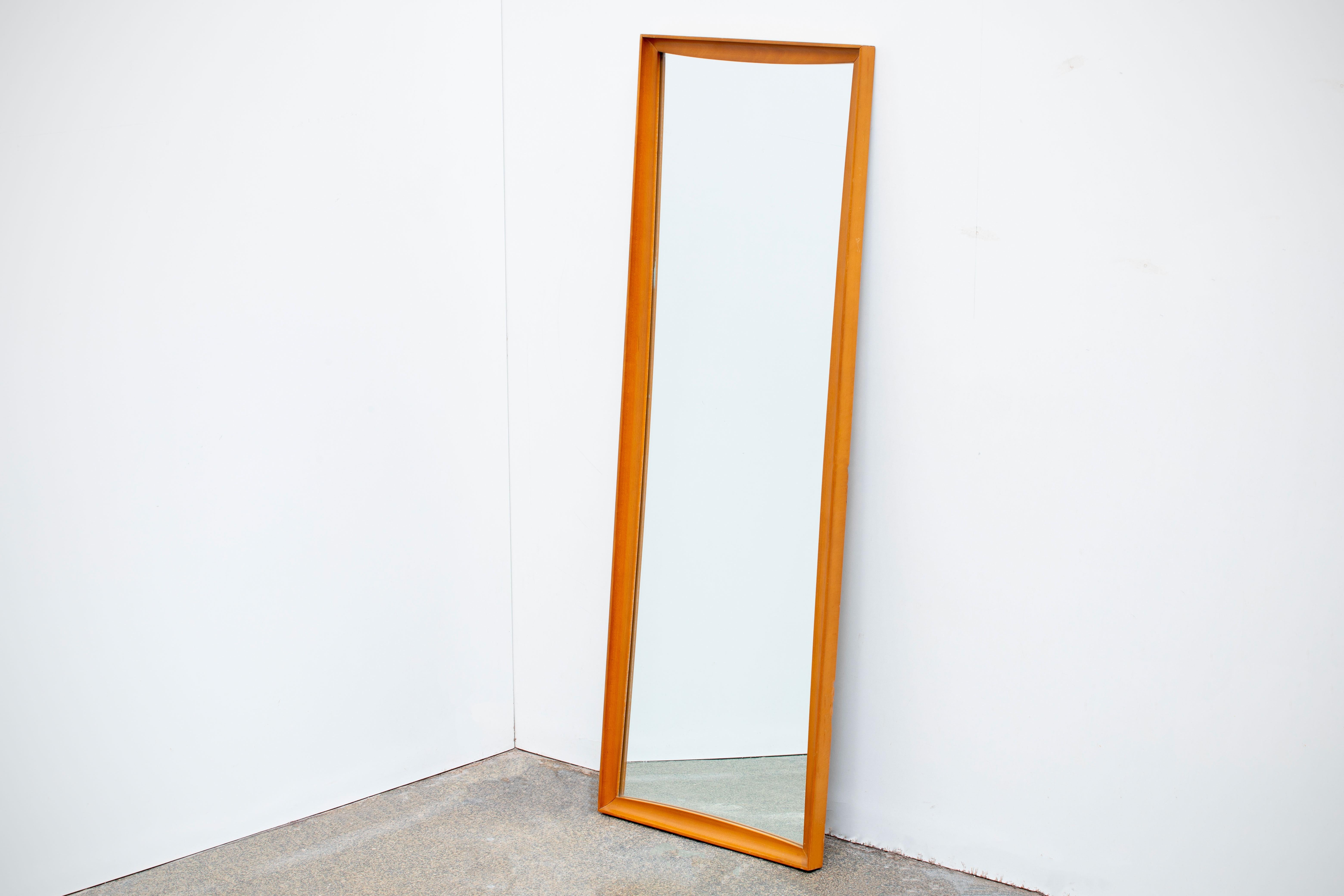 Mid-Century Modern teak framed wall mirror. In excellent original condition.
  