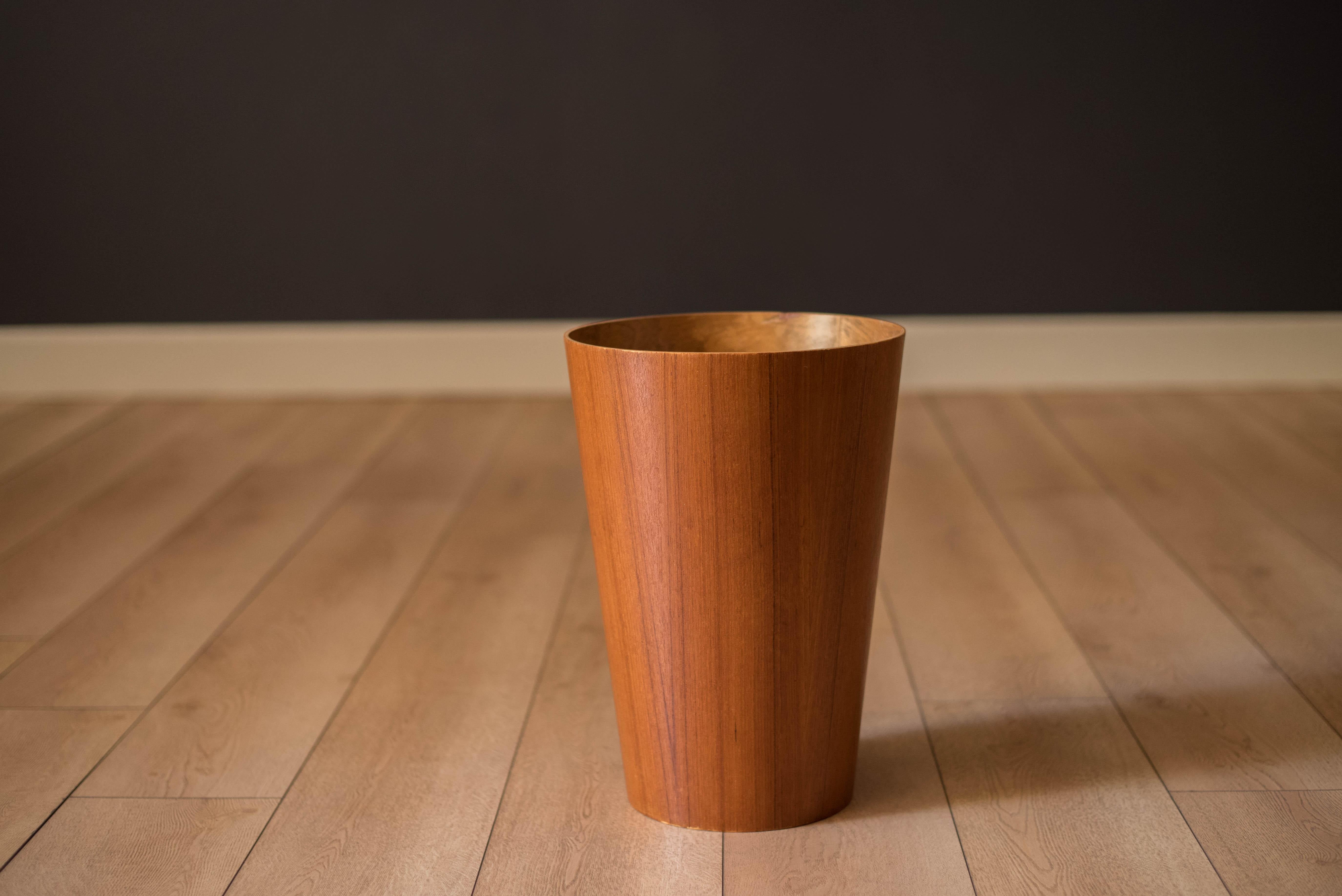 Vintage mid century waste paper bin in teak, circa 1960s. This functional decor piece is the perfect accessory for any office or home interior.