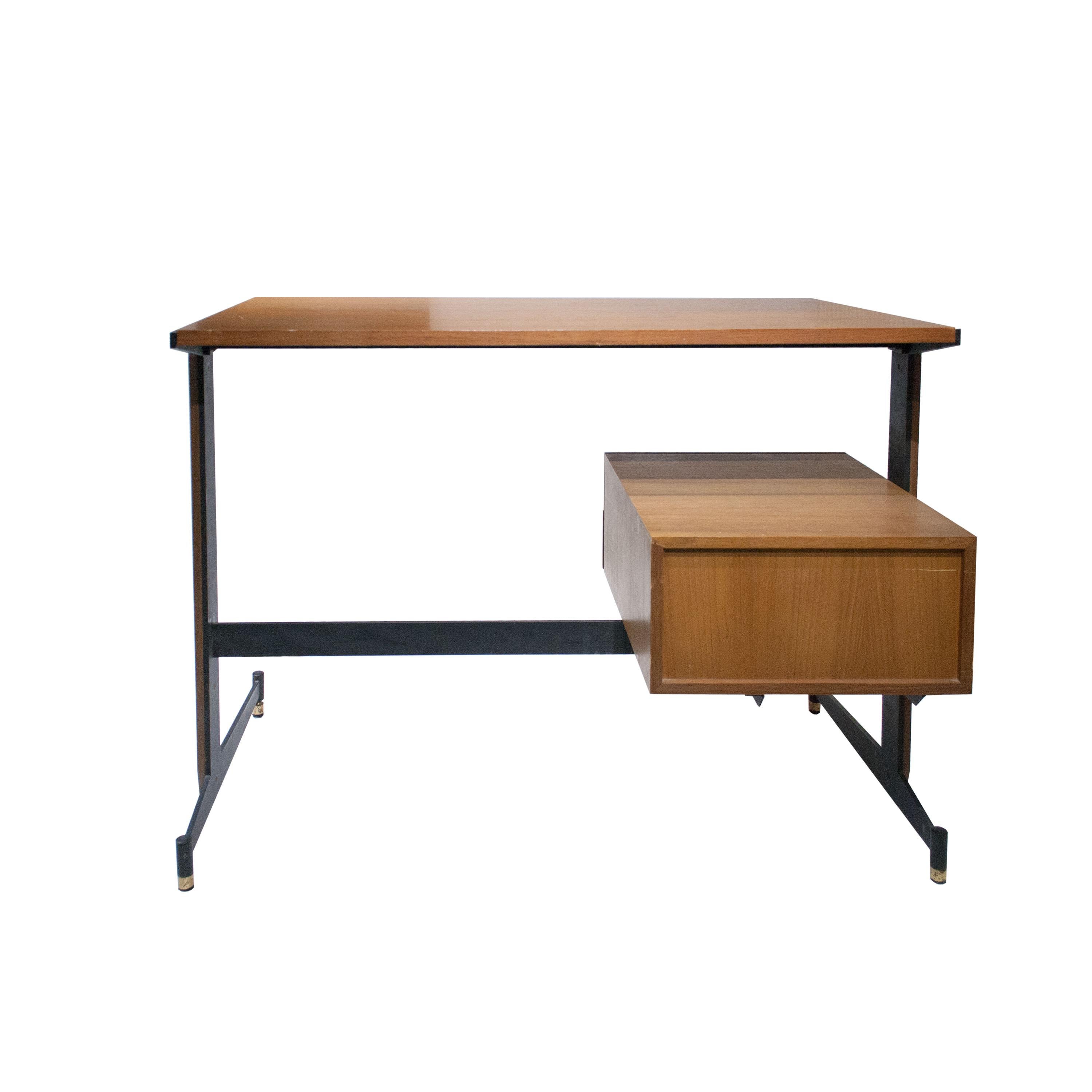 1950's original modern desk composed of a table and 2 drawers module made of teak wood over a black lacquered steel structure with brass details on legs.