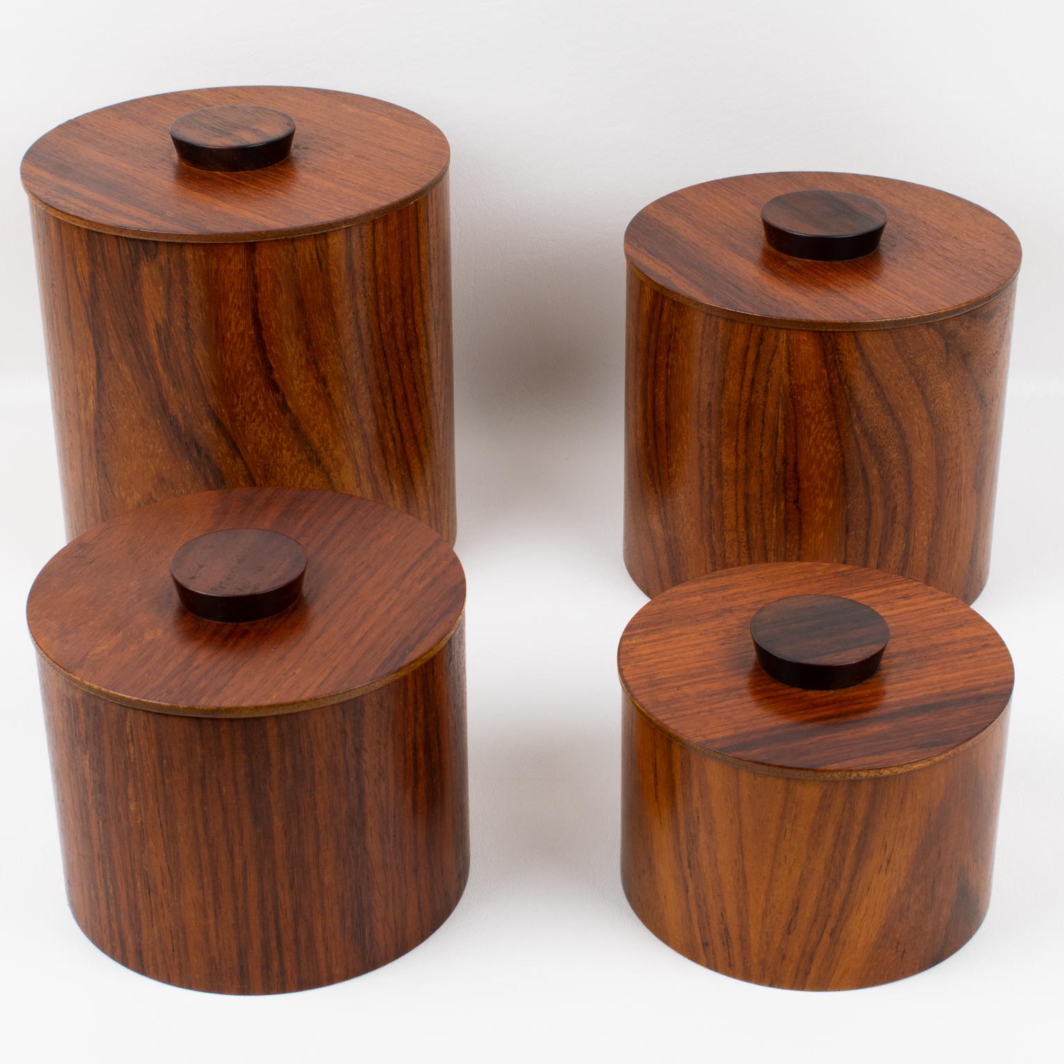 Elegant Mid-Century-Modern 1960s kitchen canister boxes, set of four pieces. Set of four Japanese modernist teak wood kitchen canisters. This sleek teak box set is perfect for any kitchen. Each box is unique and made with turned wood with a