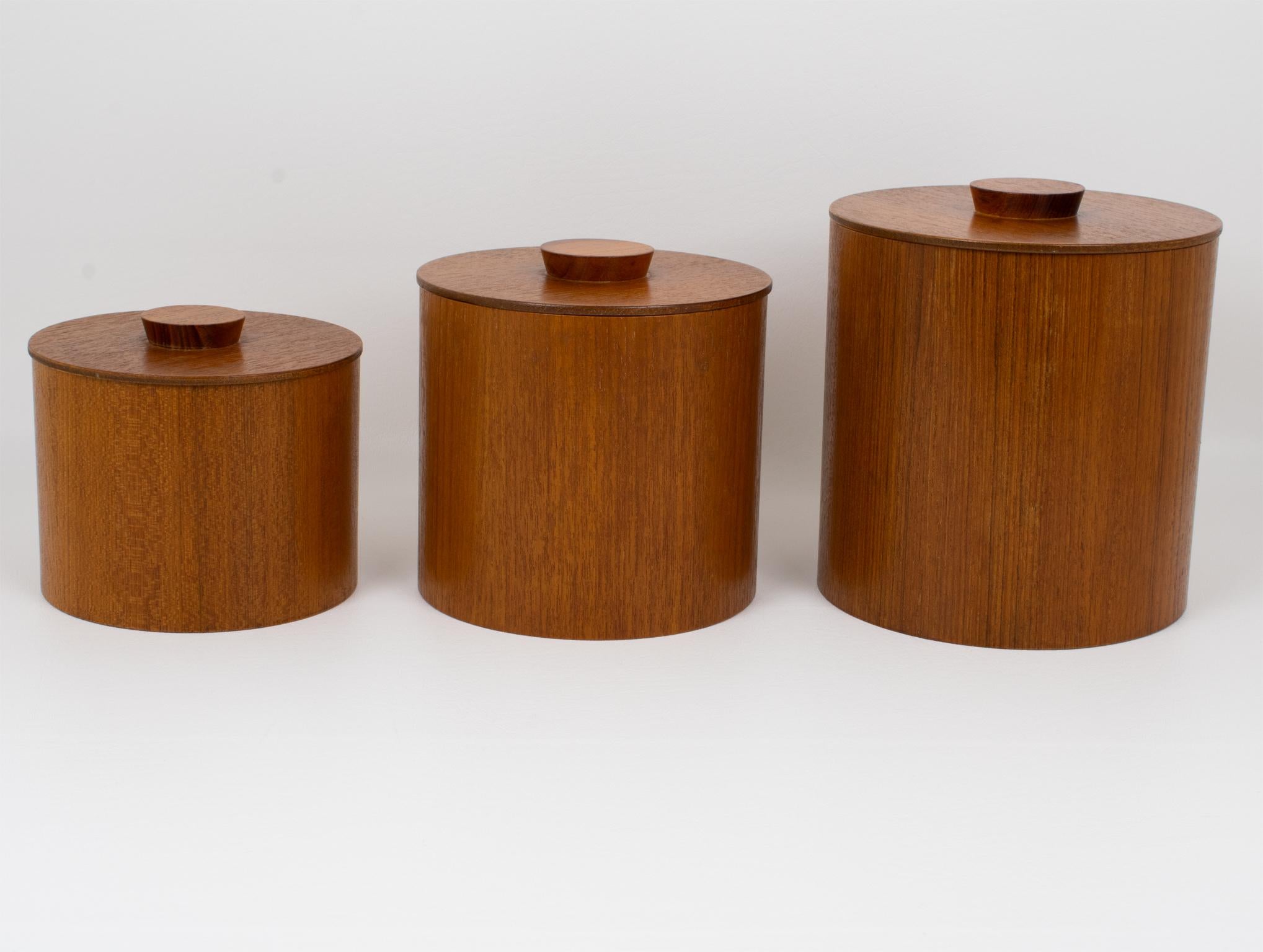 These elegant Mid-Century-Modern kitchen jars or boxes were crafted in Japan in the 1960s. The set of three pieces features Japanese modernist teak wood kitchen canisters. This sleek teak box set is perfect for any kitchen. Each box is crafted from