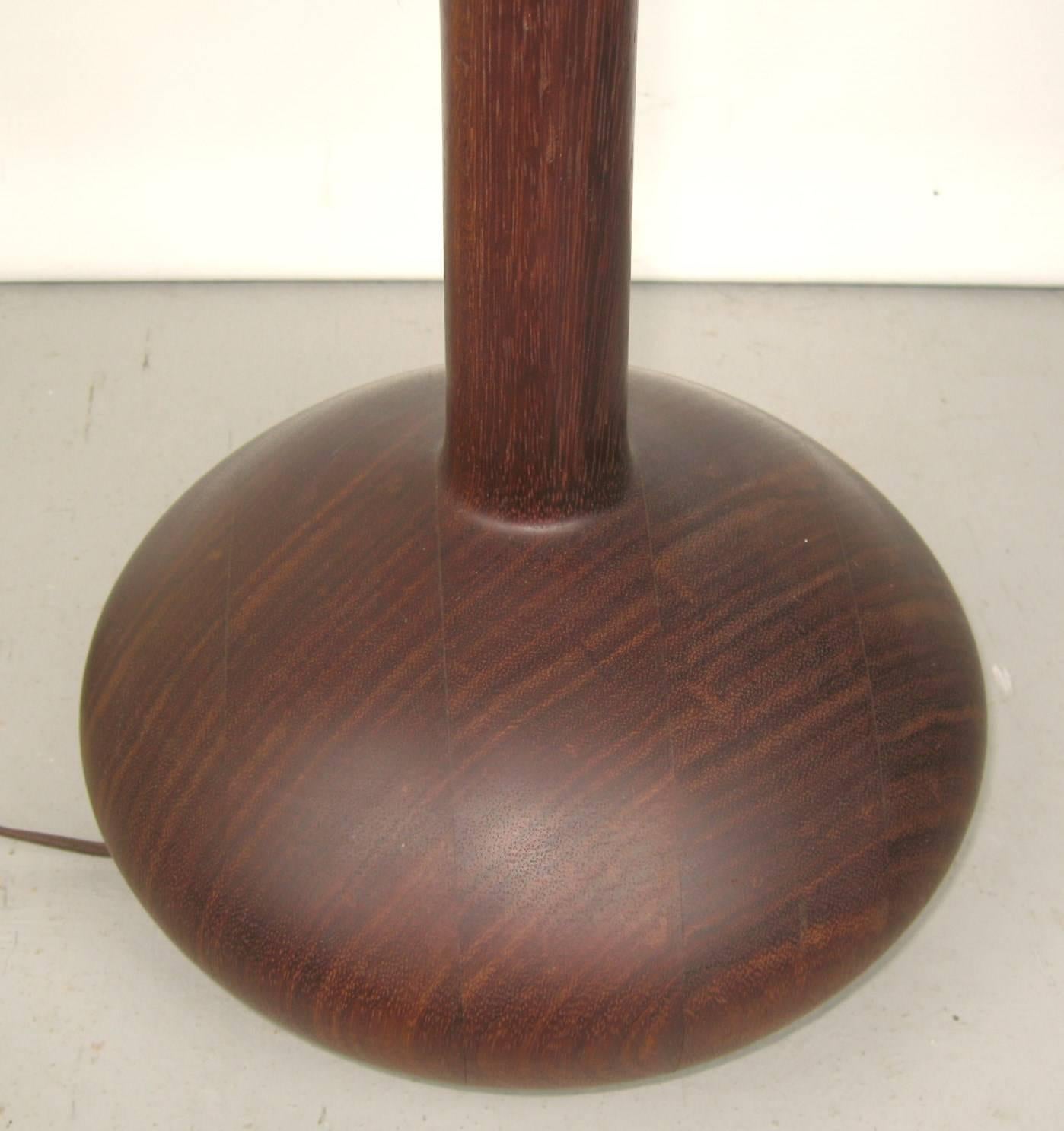 1950s-1960s stunning Mid-Century Modern teak wood table lamp. Measuring: 28.5 in down from finial to base. 19.5 in high 9 in diameter on the base, 1.75 in on the shaft. Be sure to check our storefront for many more decorating ideas, from primitives,