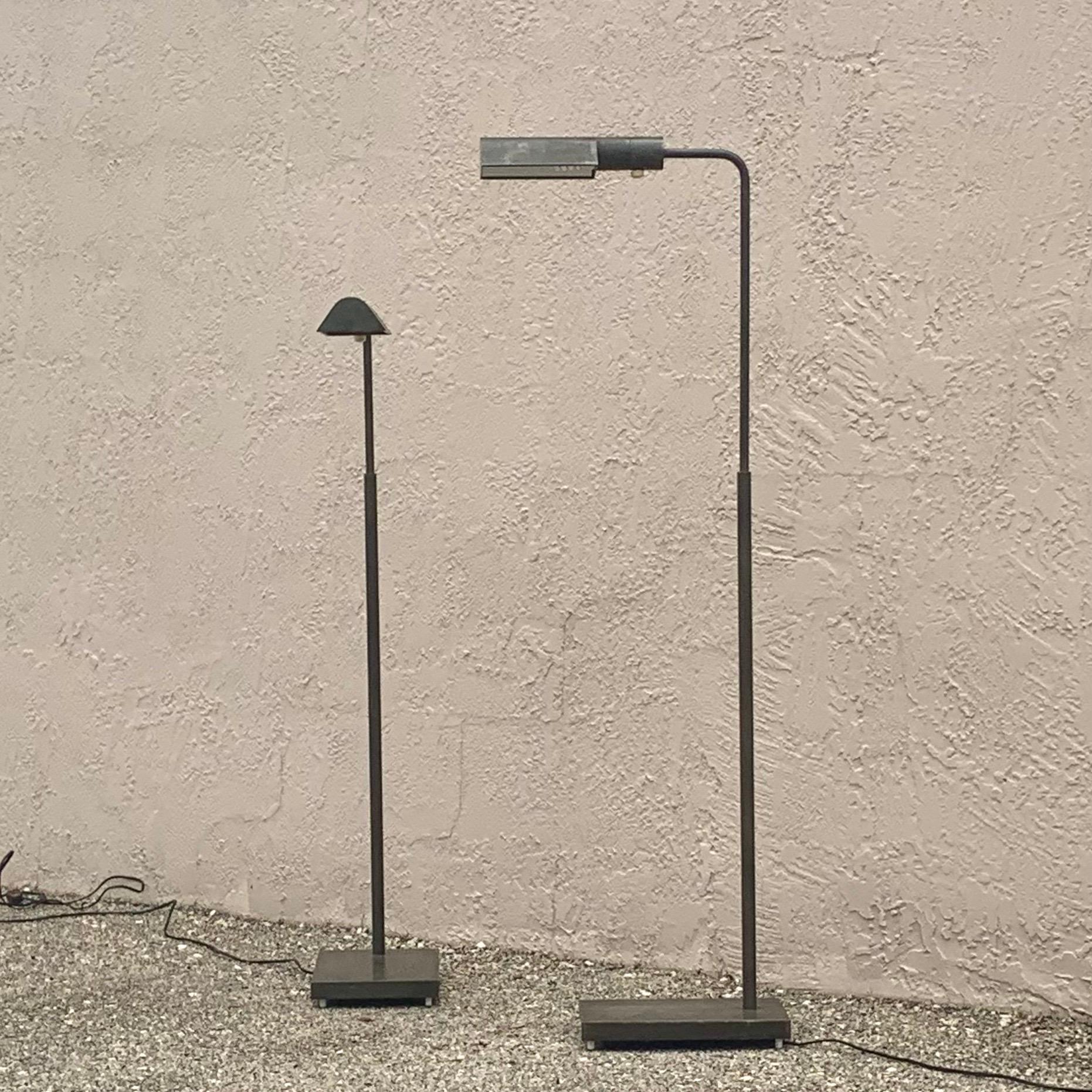 Pair of telescoping floor lamps made by Casella. Refined and sleek design. Lamps are in good working condition with some of the coolest patina I’ve seen. The antiqued bronze finished has turned to a beautiful blend of greens and greys. Truly a one