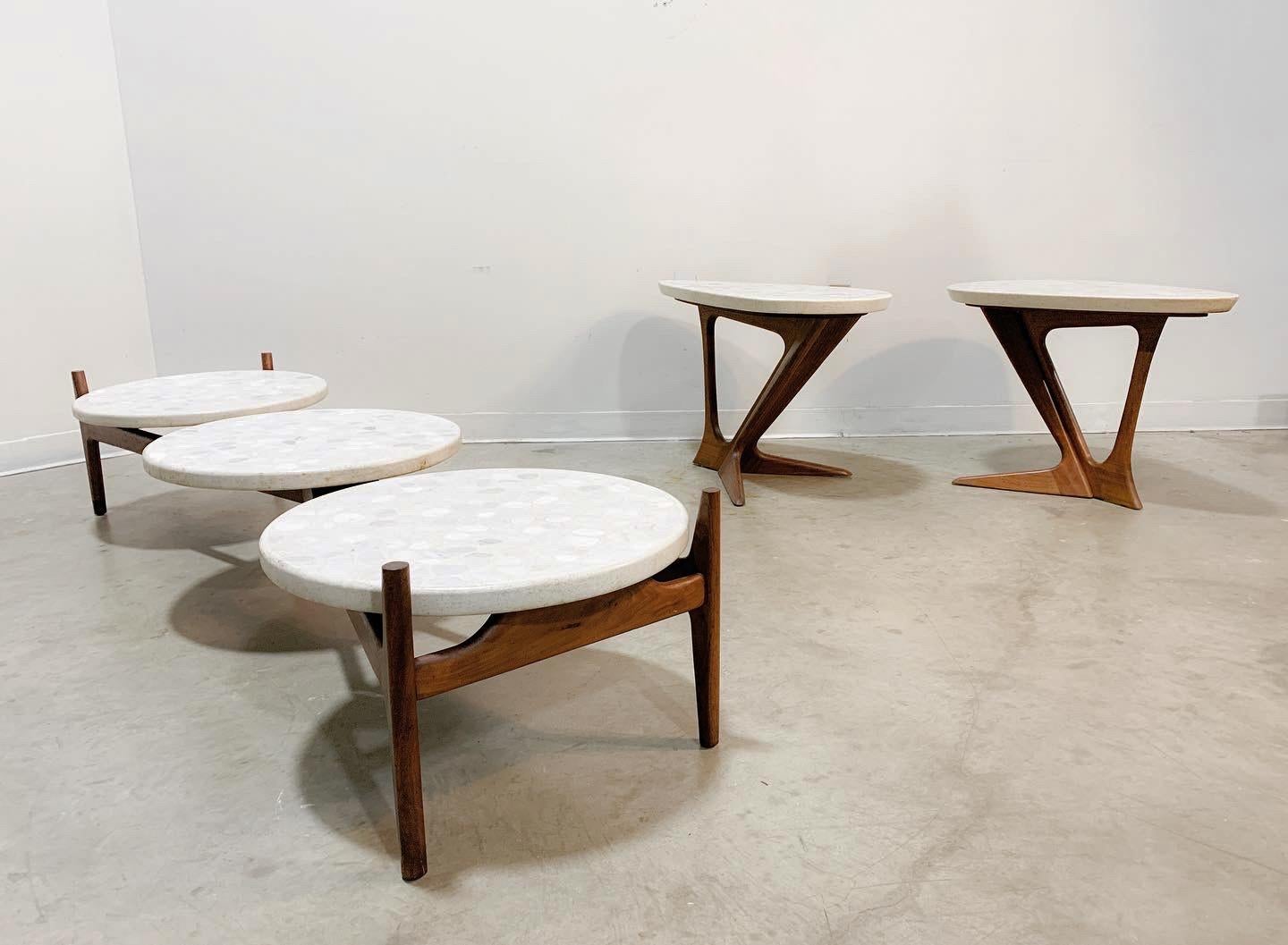 Stunning coffee and side table set with sculpted walnut bases and beautiful terrazzo tops attributed to Harvey Probber.

This set is in very good condition. The walnut frames are solid, expertly crafted and have a wonderful rich wood grain. The