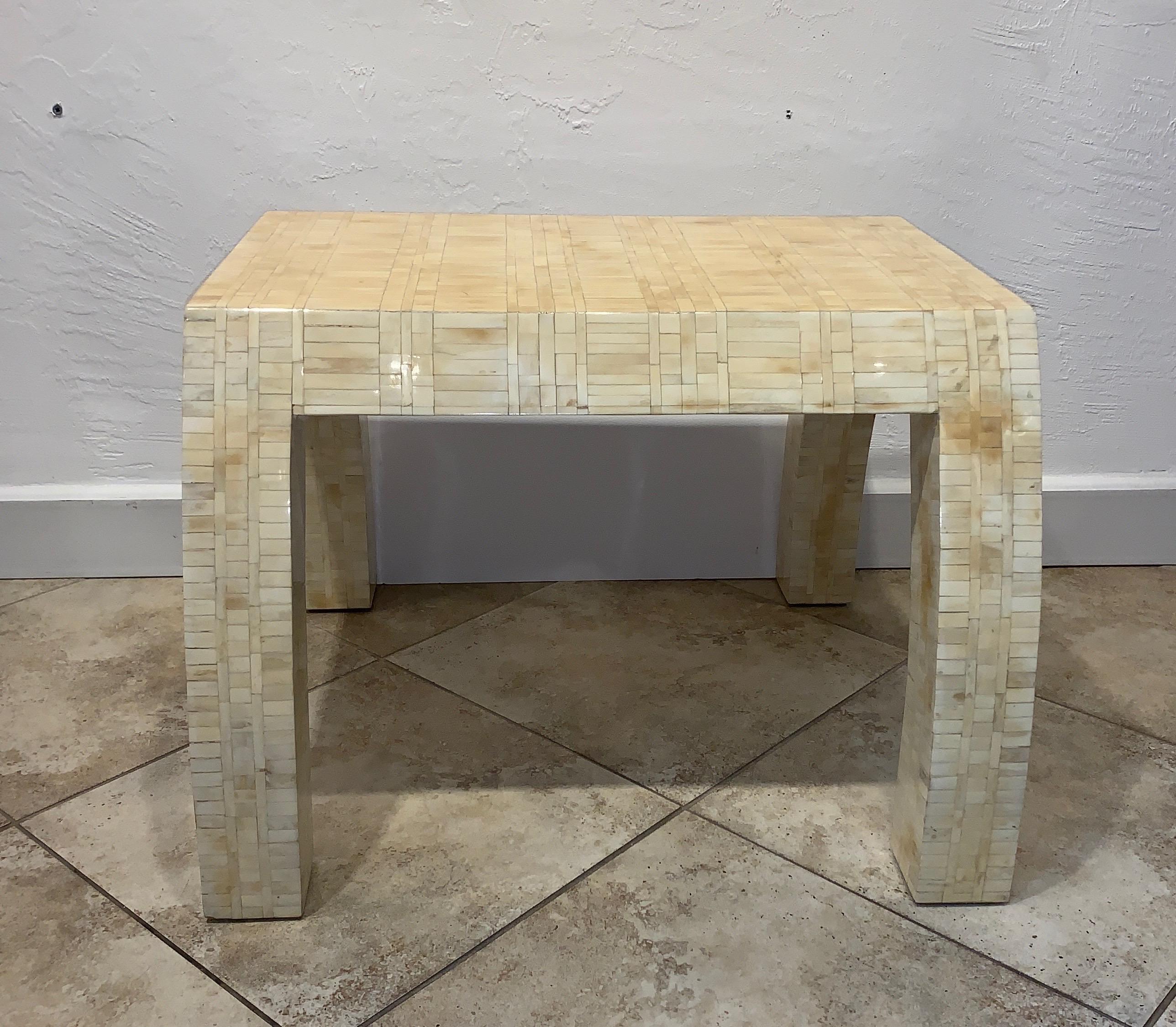 Unusual form tessellated bone end table with great design, circa 1980s.